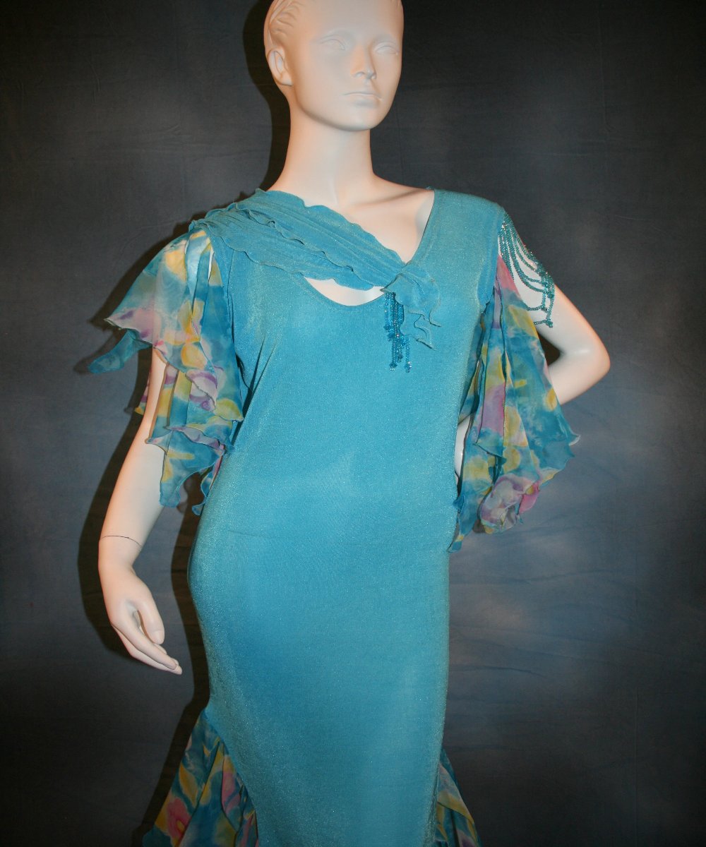 close top view of Blue social ballroom dress of luxurious robin egg blue slinky, print chiffon flounces & floats with touches of orchid & yellow, embellished with Swarovski hand beading, is lovely for any ballroom dance or special occasion, and a fabulous beginner ballroom dancer show dress!