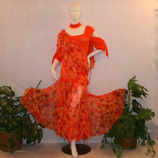 Orange ballroom dress with 3/4 cold shoulder, billowy sleeves, created of luxurious orange solid slinky & yards of an orange tropical print textured chiffon. 