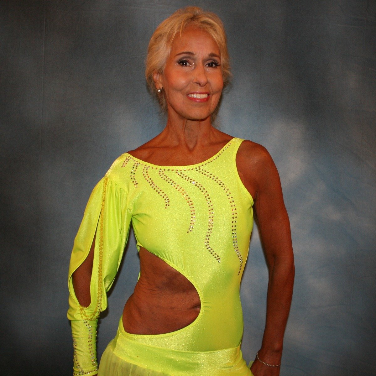 Crystal's Creations close up view of florescent yellow theatrical ballroom show dance dress
