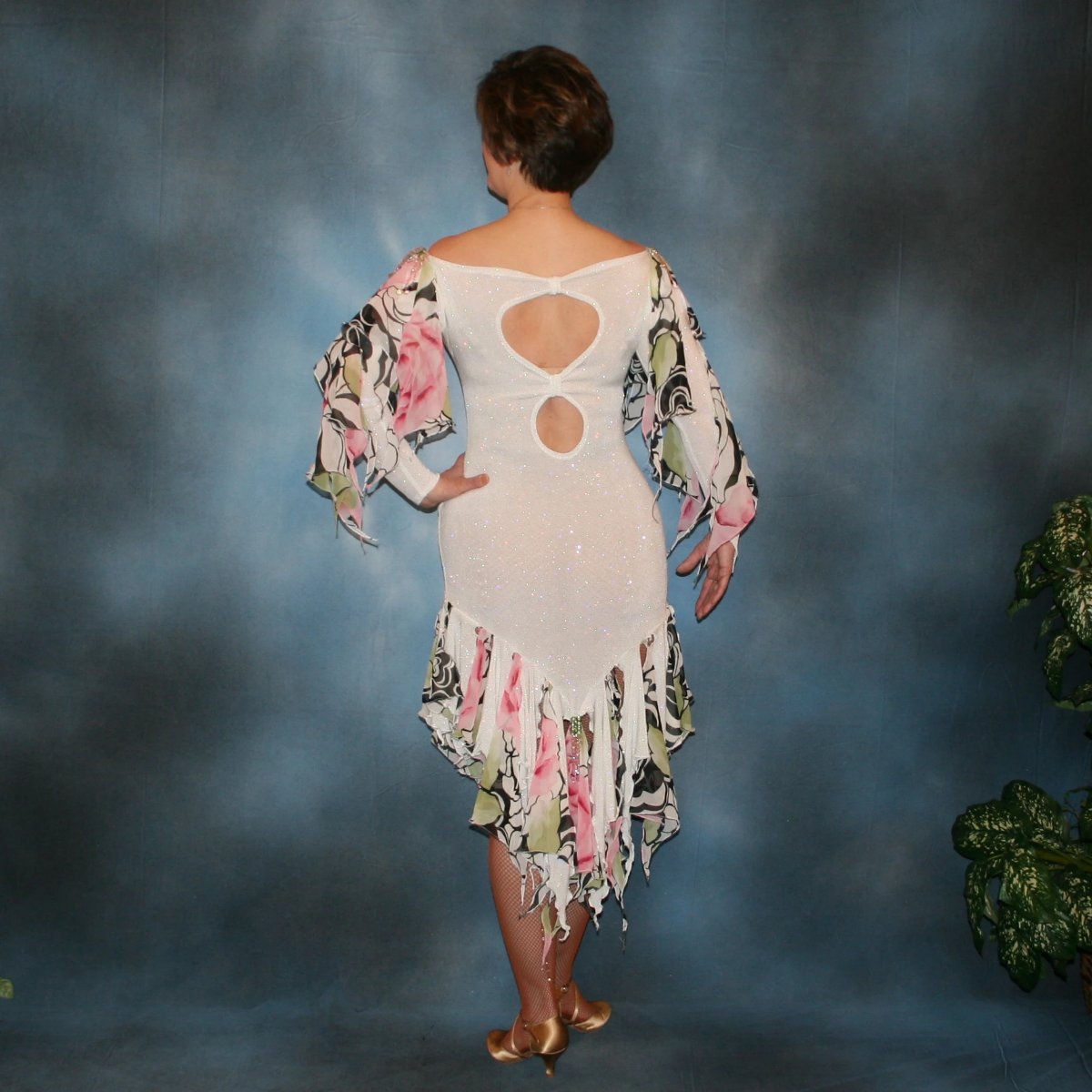 Crystal's Creations back view of White ballroom converta dress created in white glitter slinky & rose print chiffon consisting of a Latin/rhythm dress with cascades of flounces on sleeves & skirt bottom