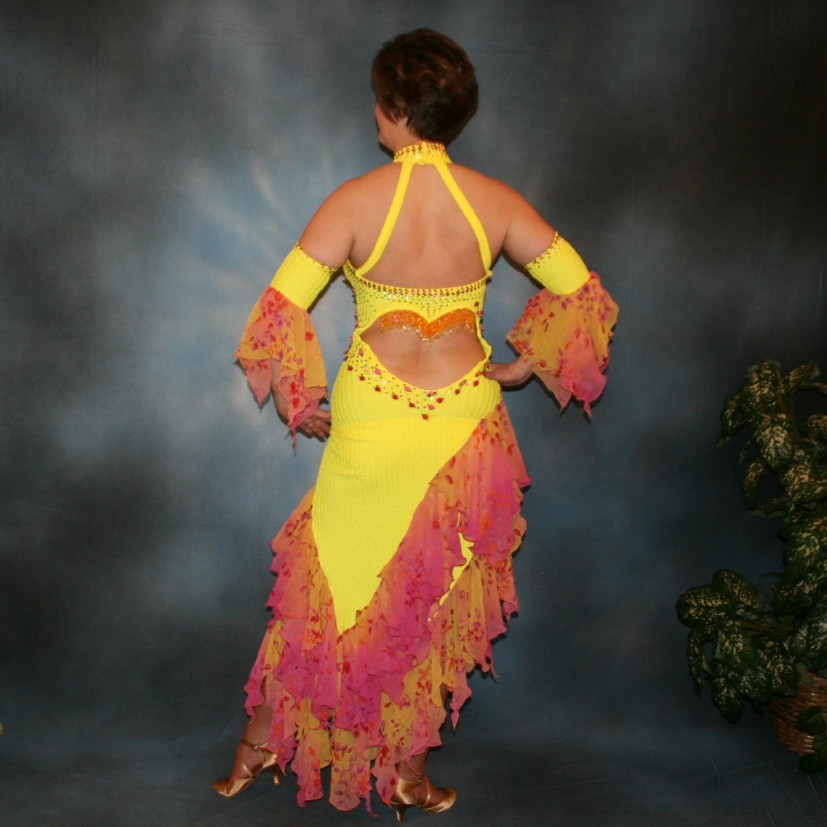 Crystal's Creations back view of Yellow Latin/rhythm dress created in textured lycra, features silk roses along with rose, jonquil(yellow) & hyacinth(orange) Swarovski rhinestones, and 2 rows of flounces of a gorgeous delicate oriental floral print chiffon.
