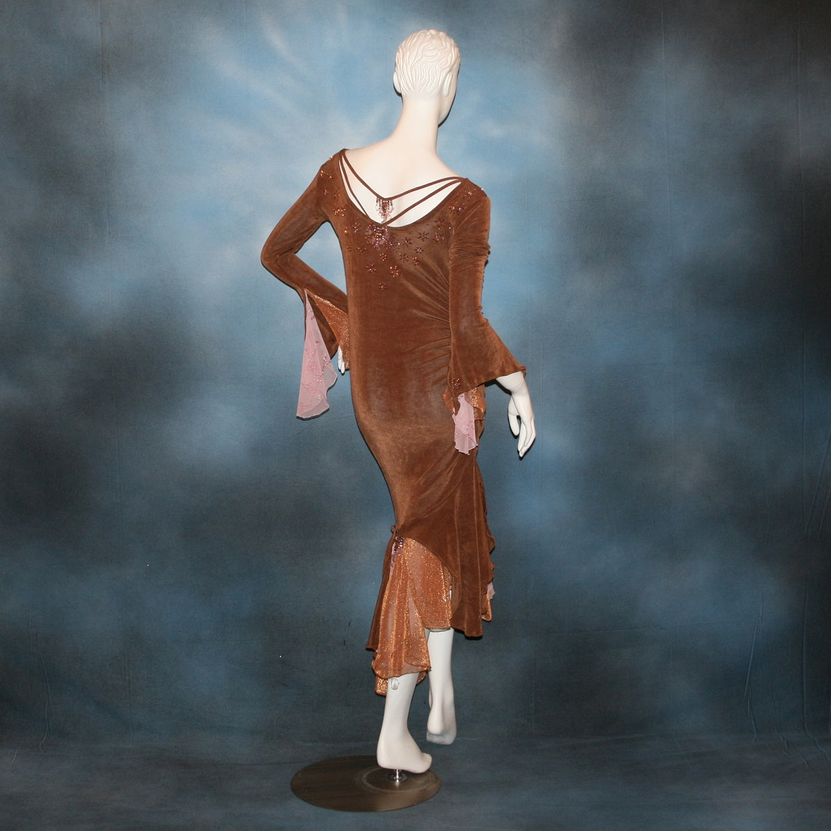 back view of Latin/rhythm dress created of luxurious solid slinky in cinnamon brown with accents of bronze & soft pink is lavishly embellished with Swarovski 