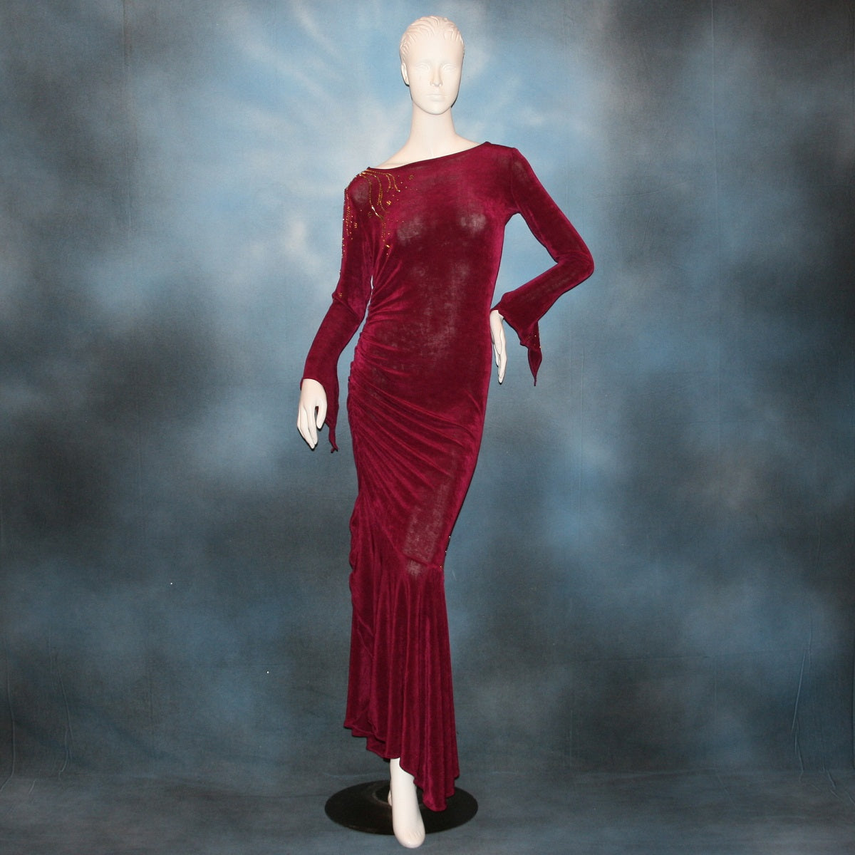 Crystal's Creations Magenta Latin/rhythm/tango dress created out of deep magenta/wine slinky features ruching, long flared sleeves & is embellished with gold aurum Swarovski rhinestone work 