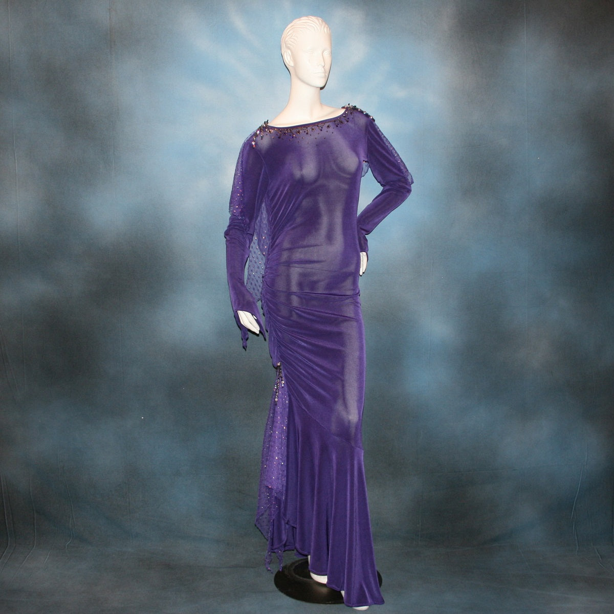 Crystal's Creations Purple Latin/rhythm/tango dress created of deep grape purple solid slinky with a touch of Swarovski rhinestone work done in metallic light gold & deep velvet purple, along with some hand beading & some gorgeous glittery floats.