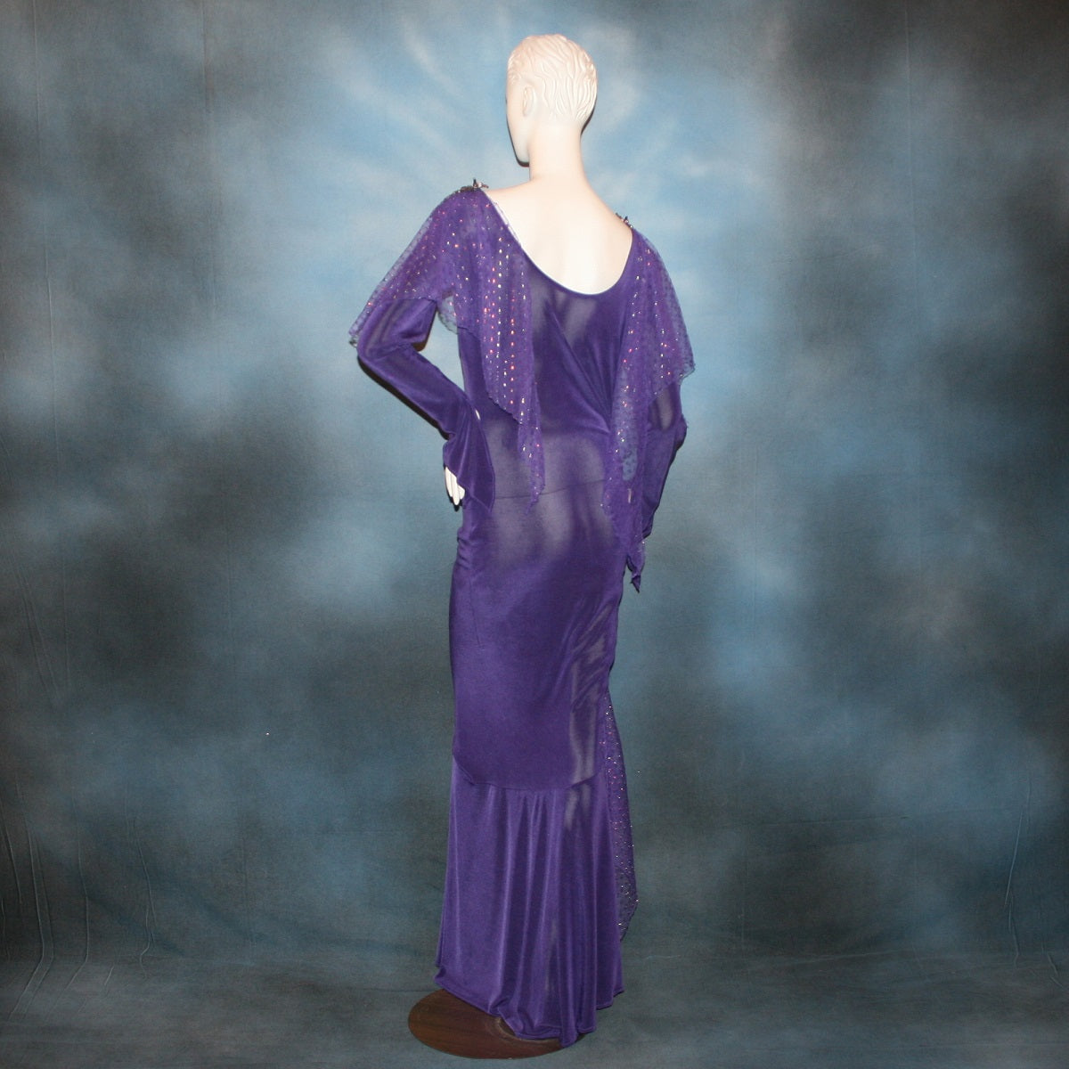 back view of Crystal's Creations Purple Latin/rhythm/tango dress created of deep grape purple solid slinky with a touch of Swarovski rhinestone work done in metallic light gold & deep velvet purple, along with some hand beading & some gorgeous glittery floats.