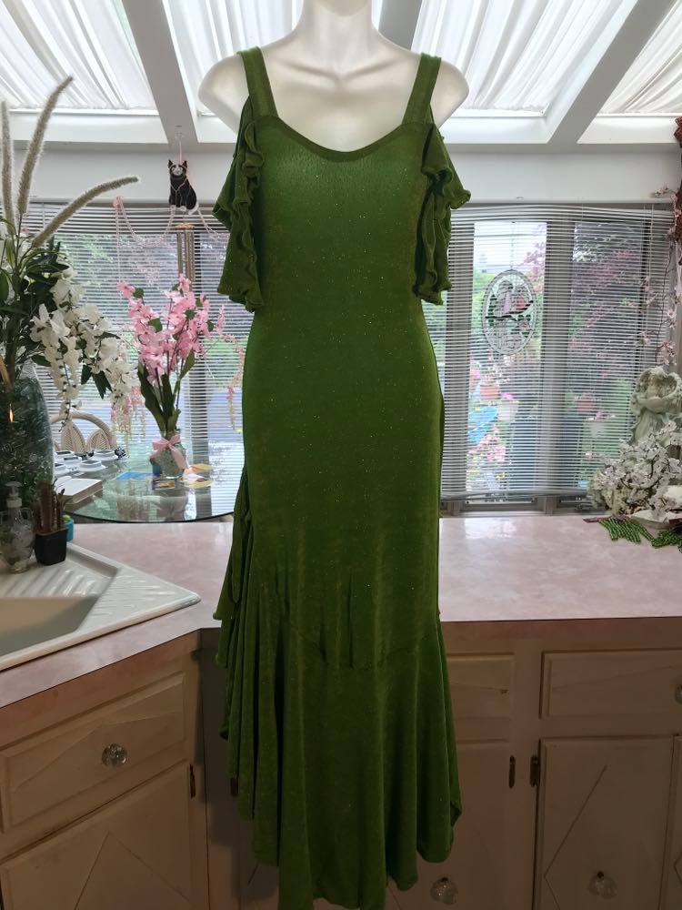 Apple green social Latin/rhythm/tango dress created of apple green glitter slinky with full flared bottom skirting & cold shoulder petal flounce sleeves.