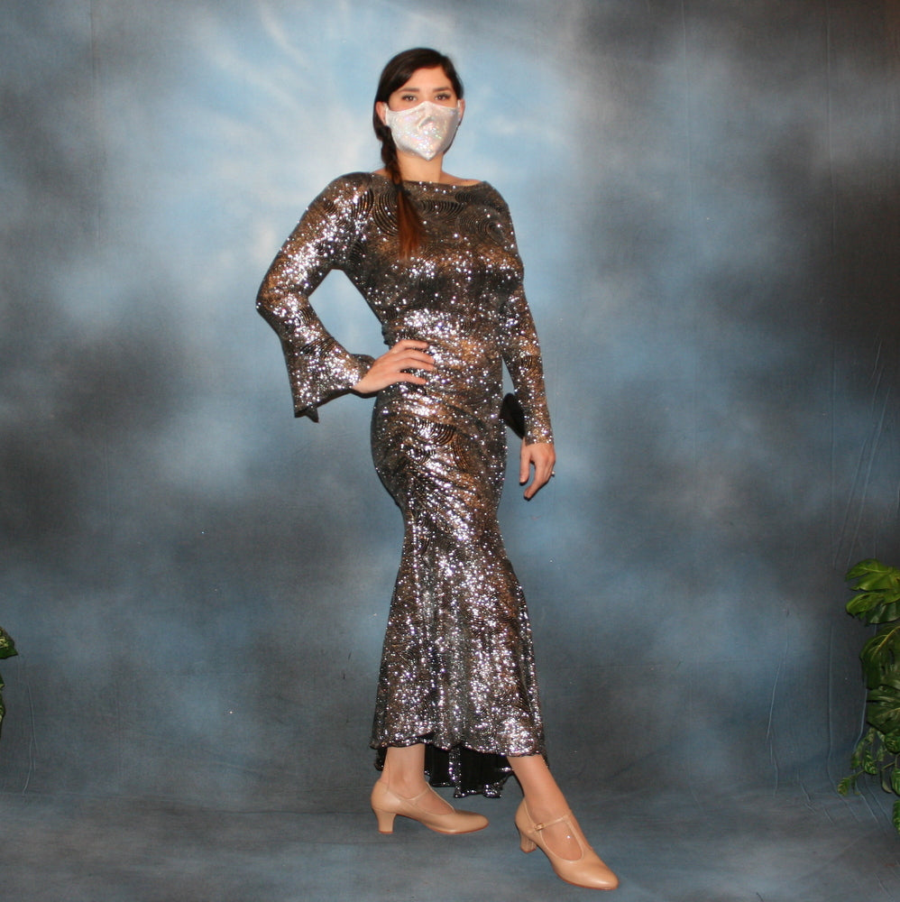 Crystal's Creations Silver Latin/rhythm/tango dress created of silver swirls glitter slinky with sleek & elegant lines, long flared sleeves & low back with strap details, size 5/6-11/12, very stretchy