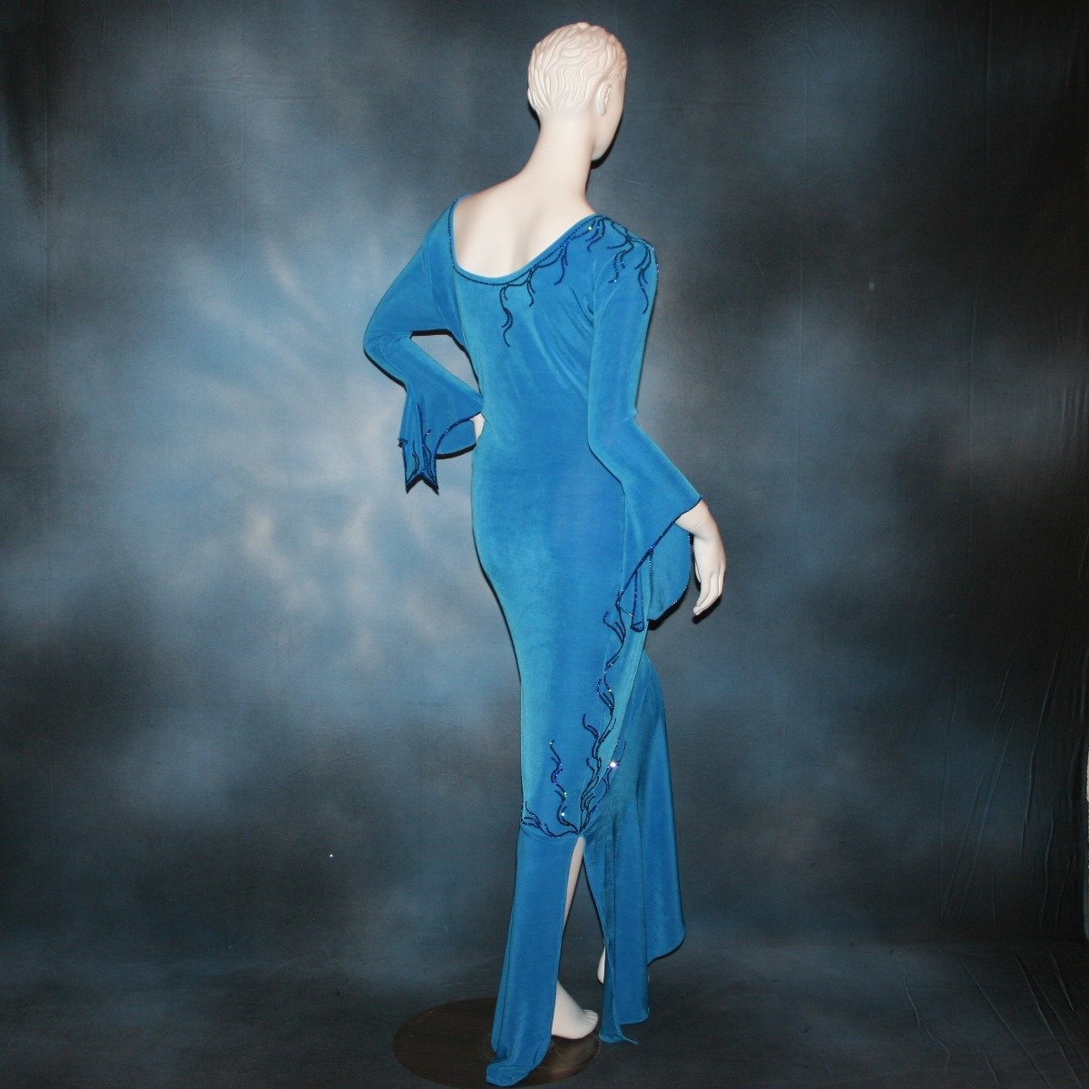 Crystal's Creations back view of blue Latin/rhythm dress created of luxurious blue slinky, embellished with Swarovski detailed rhinestone work