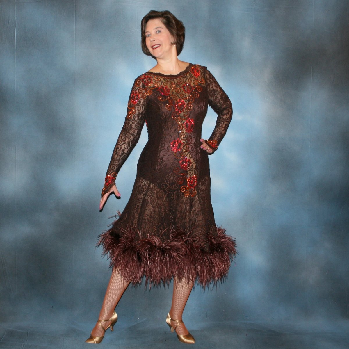Crystal's Creations Chocolate brown Latin/rhythm dance dress of stretch lace lavished with detailed Swarovski stonework done in Indian pink* & crystal copper… with ostrich feathers adorning the skirt edge…and includes under bodysuit.