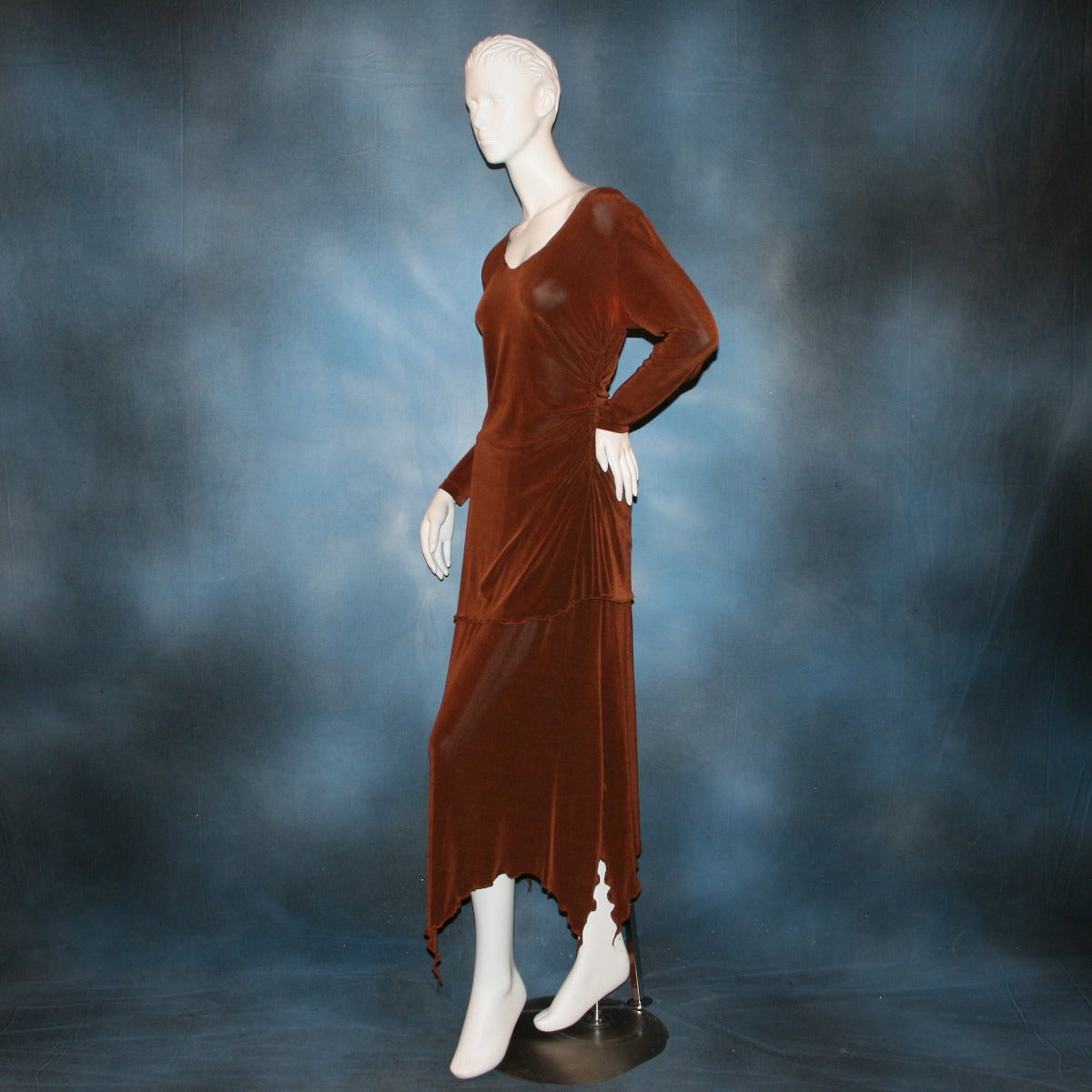 side view of Cinnamon brown long sleeve angle cut tunic top includes A-line skirt with angle cuts of cinnamon brown colored solid slinky fabric, of which the tunic top can be worn as a simple Latin/rhythm dress... can be custom created in many colors.