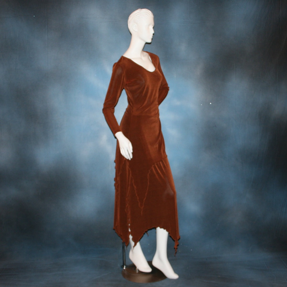 right side view of Cinnamon brown long sleeve angle cut tunic top includes A-line skirt with angle cuts of cinnamon brown colored solid slinky fabric, of which the tunic top can be worn as a simple Latin/rhythm dress... can be custom created in many colors.