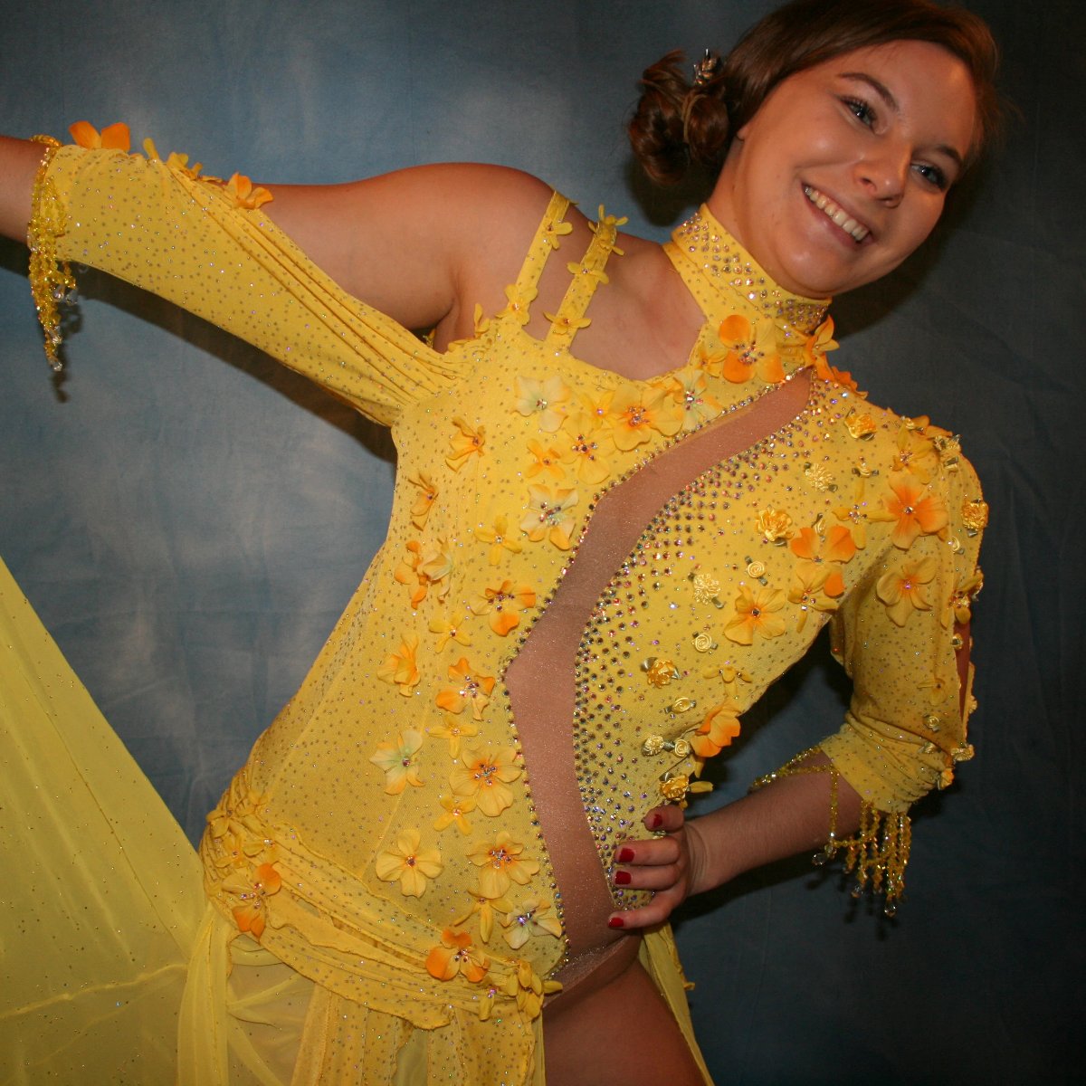 Crystal's Creations close up view of Yellow ballroom dress created in sunny yellow slinky glitterknit with glitter gold flocked yellow chiffon