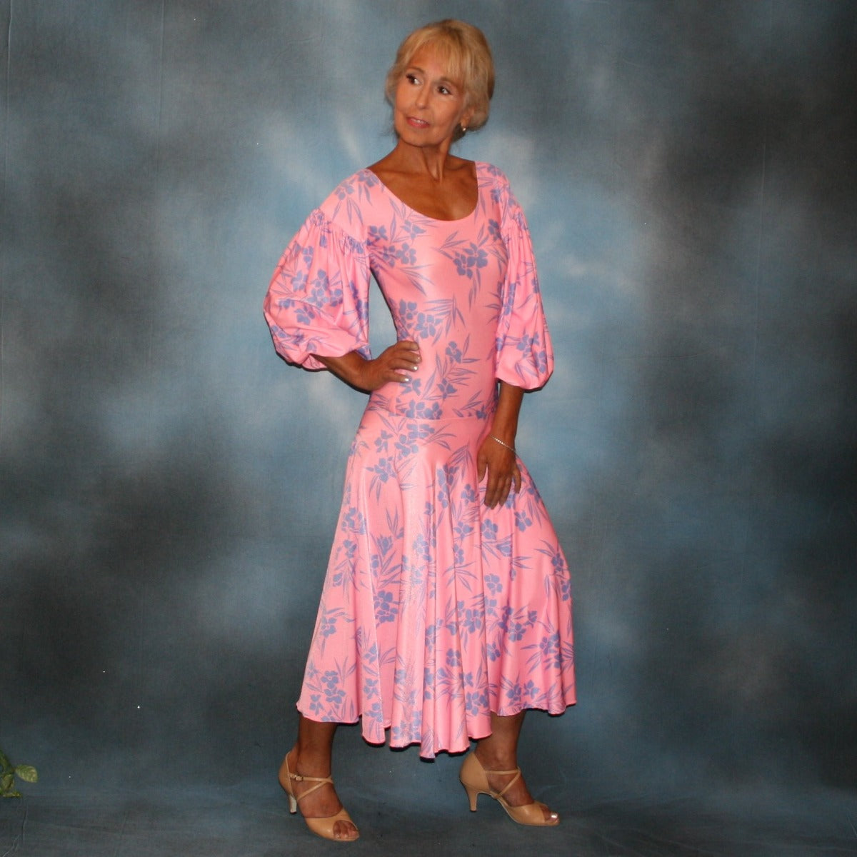 Soft pink & blue tropical print lycra dress created of tropical print lycra with drop shoulder pouf sleeves & full circle skirt, with a bodysuit base, so a great dress for Latin/rhythm dance practice, as well as a great ballroom dance teacher dress, especially if you work on drops & lifts!