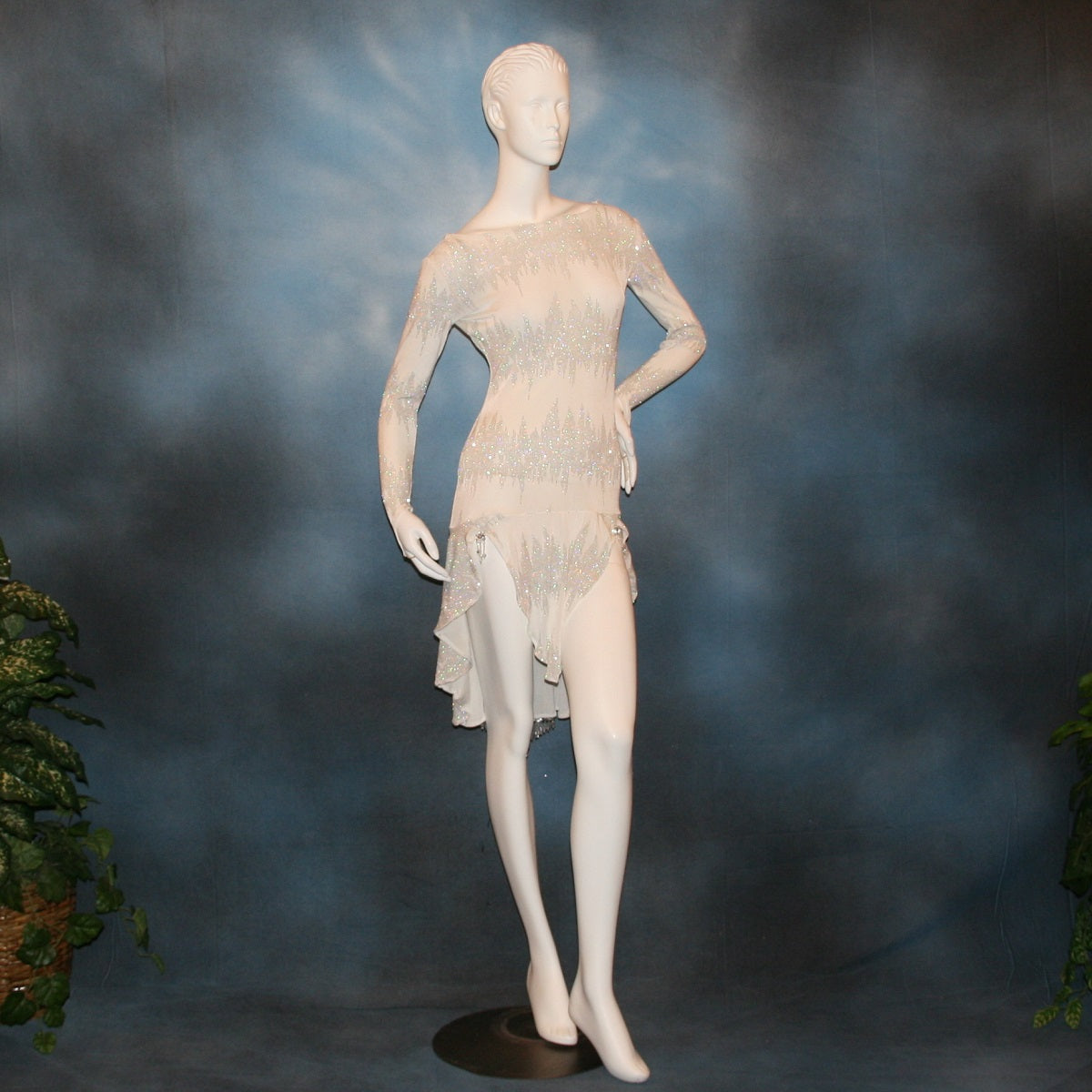 White Latin/Rhythm dress created in glitter slinky with an awesome electrifying glitter pattern, features long sleeves, lattice strap details on back & a touch of Swarovski hand beading in the skirting.