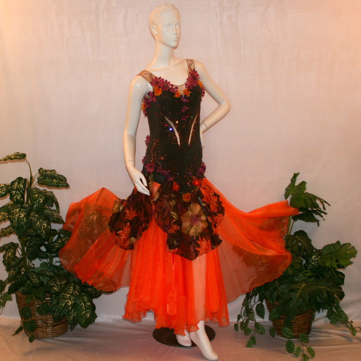 Brown converta ballroom dress created in deep chocolate brown slinky on a nude illusion base with panels of a gorgeous flowered chiffon with a sheen in browns, oranges, yellows, greens, burgundies & purples, with silk flower embellishments & Swarovski detailed rhinestone work.