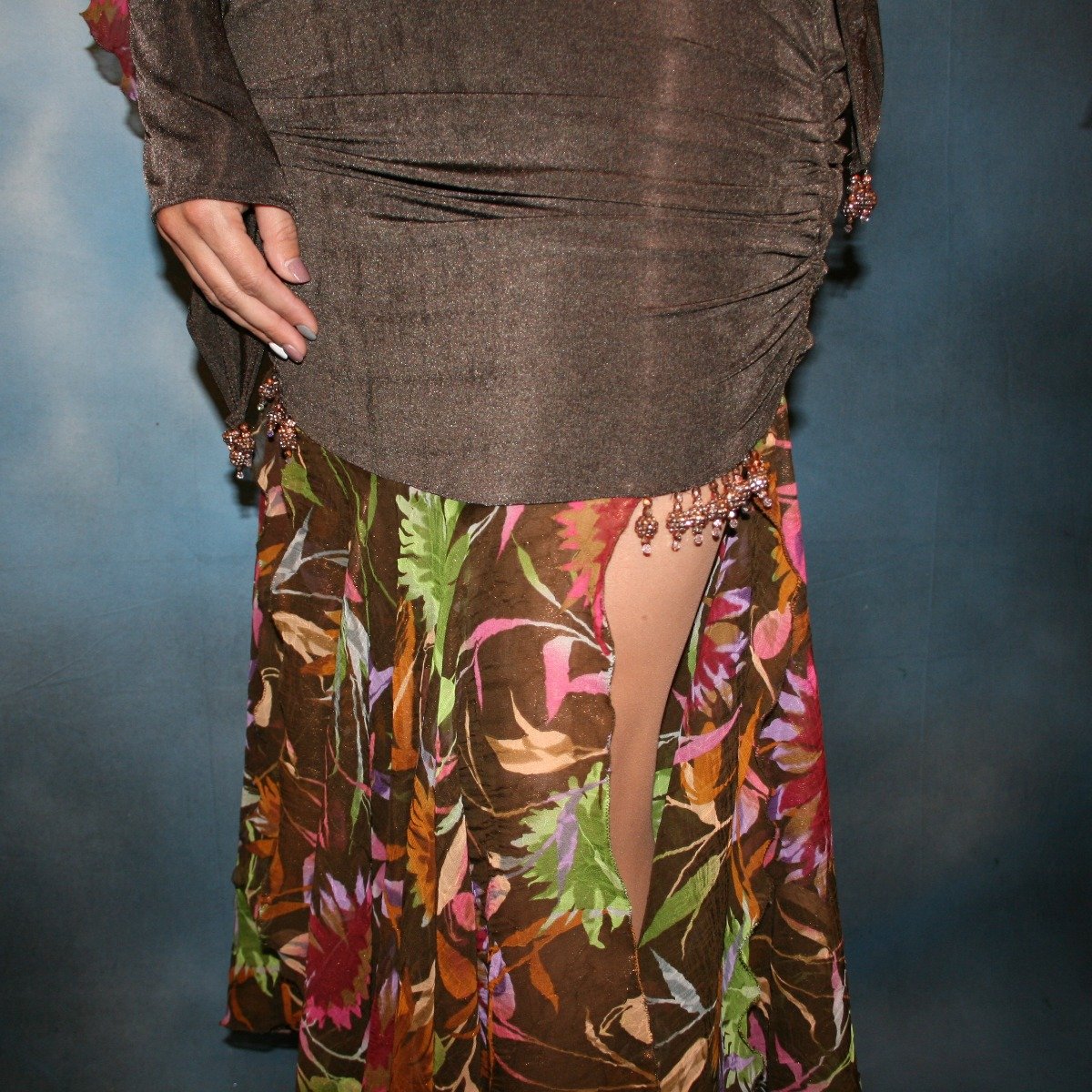 Crystal's Creations close up bottom view of brown ballroom dress created of luxurious chocolate brown slinky along with fall flowers print chiffon