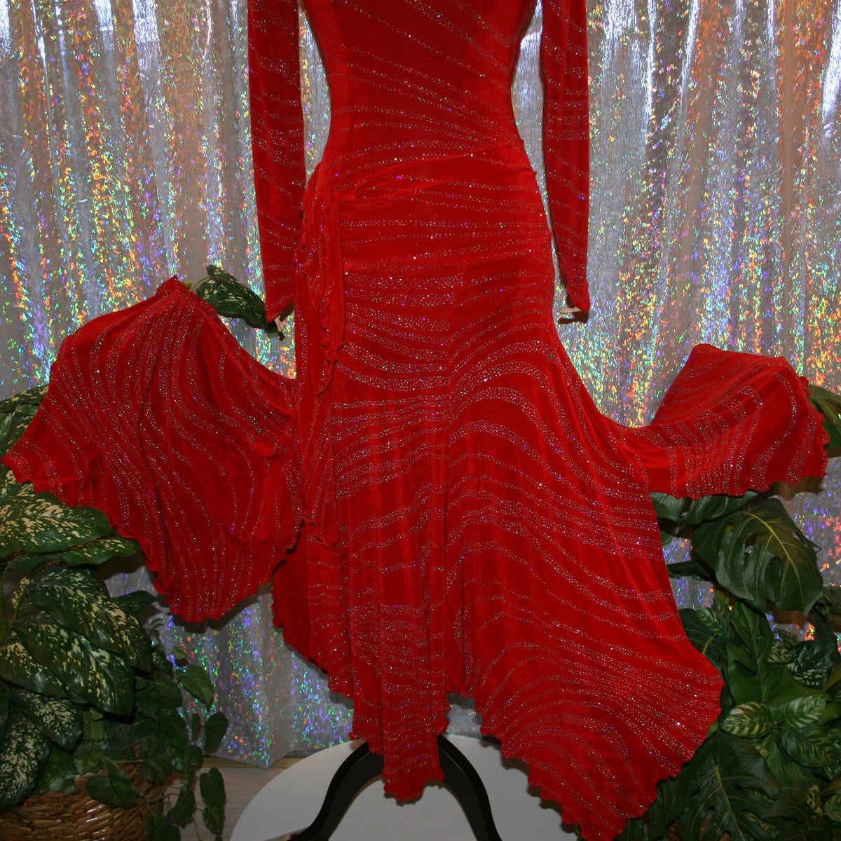 bottom view with smooth waltz skirt of Red 3 piece ballroom converta dress consisting of a long sleeve red bodysuit, Latin-rhythm skirt with hand beading, smooth waltz length skirt plus neck piece with hand beading created out of  deep red glitter slinky with a gorgeous wave pattern.