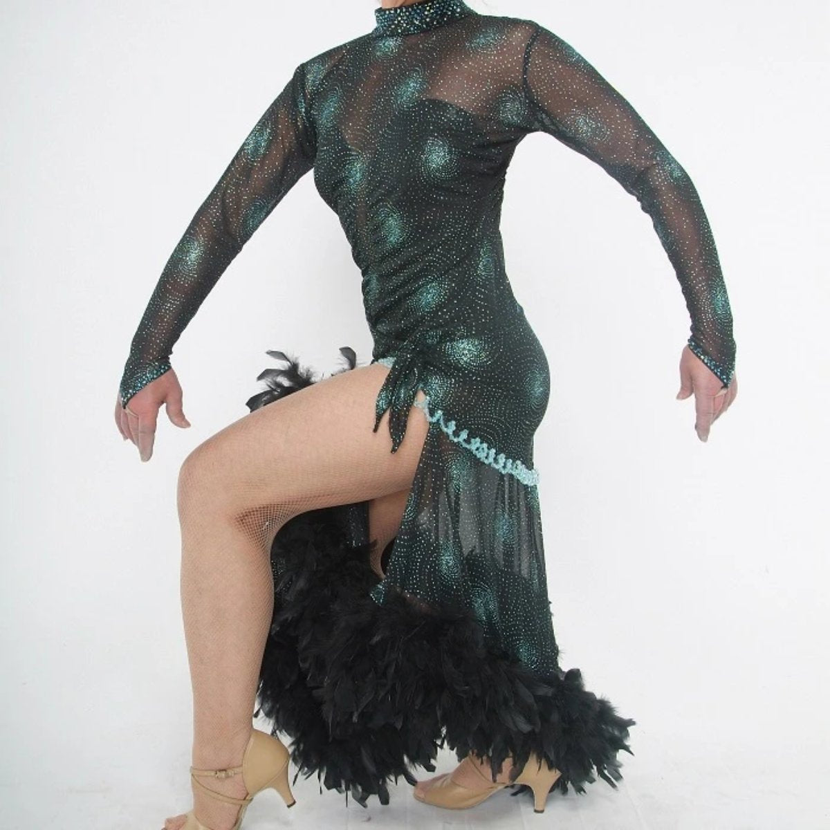 close side view of Elegant black Latin/rhythm dance dress was created in a black glitter sheer mesh with aqua glitter bursts over black lycra body suit, embellished with jet AB Swarovski stones, hand beading, plus chandelle feathers.