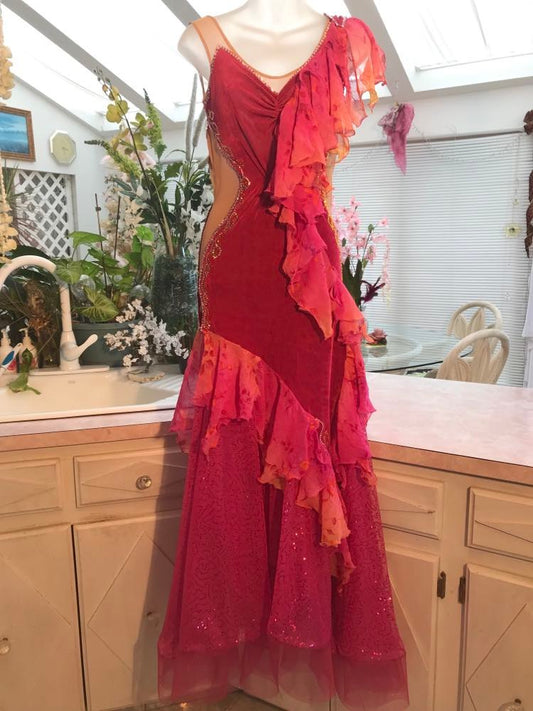 Gorgeous rose colored converta ballroom dance dress was created on a nude illusion base of rose colored slinky with flounces of a gorgeous oriental flower print crinkle chiffon of pinks, yellows & oranges. Detailed Swarovski rhinestone work which ties in so beautifully with with the print chiffon, is done in pinks, yellows & orange.