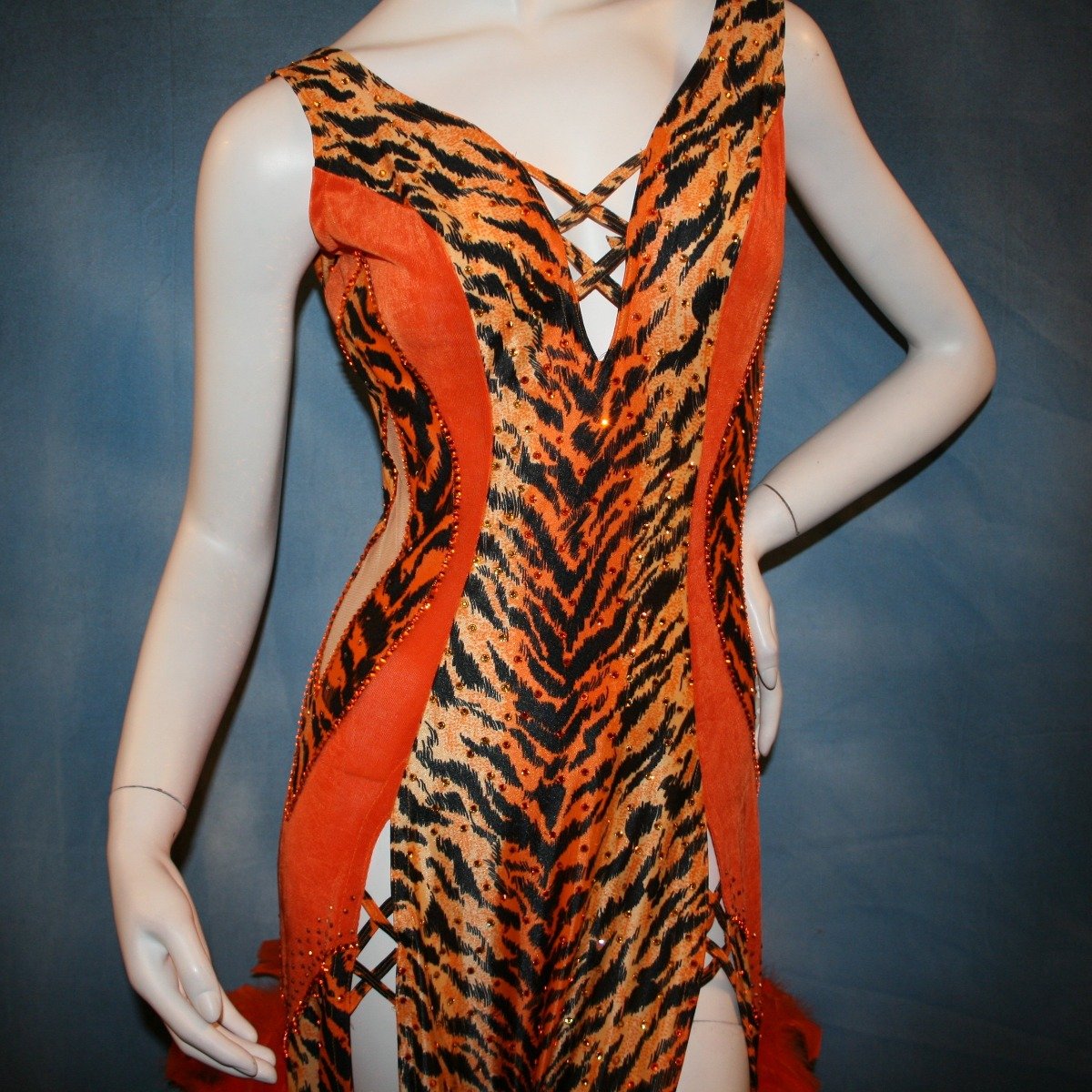 Crystal's Creations close up view of orange & black tiger print Latin/rhythm dress with chandelle feathers & hand beading