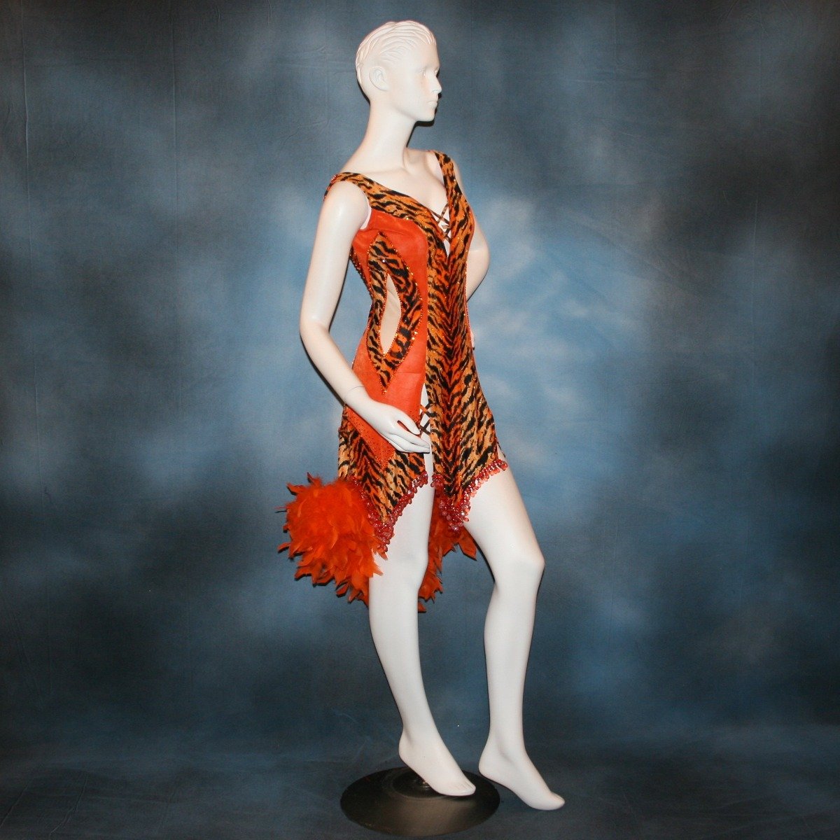 Crystal's Creations side view of orange & black tiger print Latin/rhythm dress with chandelle feathers & hand beading
