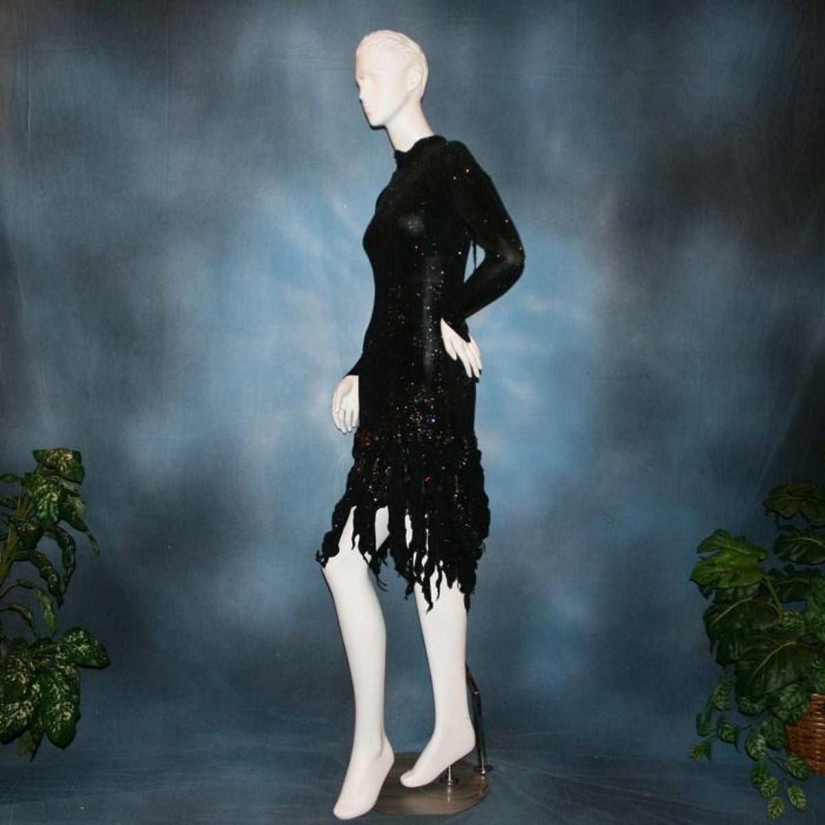 Crystal's Creations side view of Elegant black Latin/rhythm dress was created in glitter black slinky with delicate, gorgeous, yet subtle, blue & bronze print in the glitter….embellished lavishly with Swarovski hand beaded detailing through out!