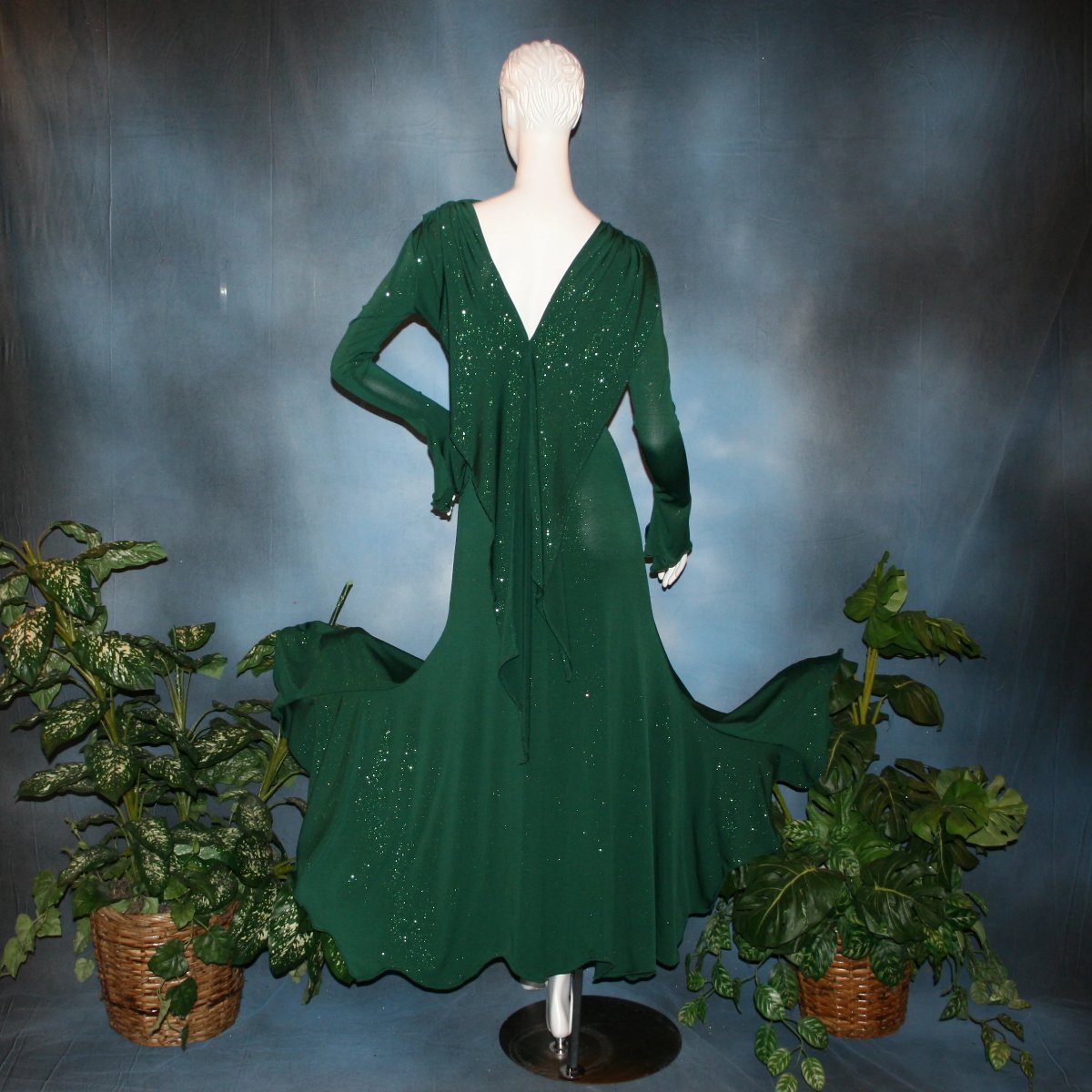 Crystal's Creations back view of Green social ballroom dress was created in luxurious deep emerald glitter slinky, with full  & flaring skirt bottom, long flair sleeves & draping trailing down the back makes this gorgeous dress very elegant & classy!