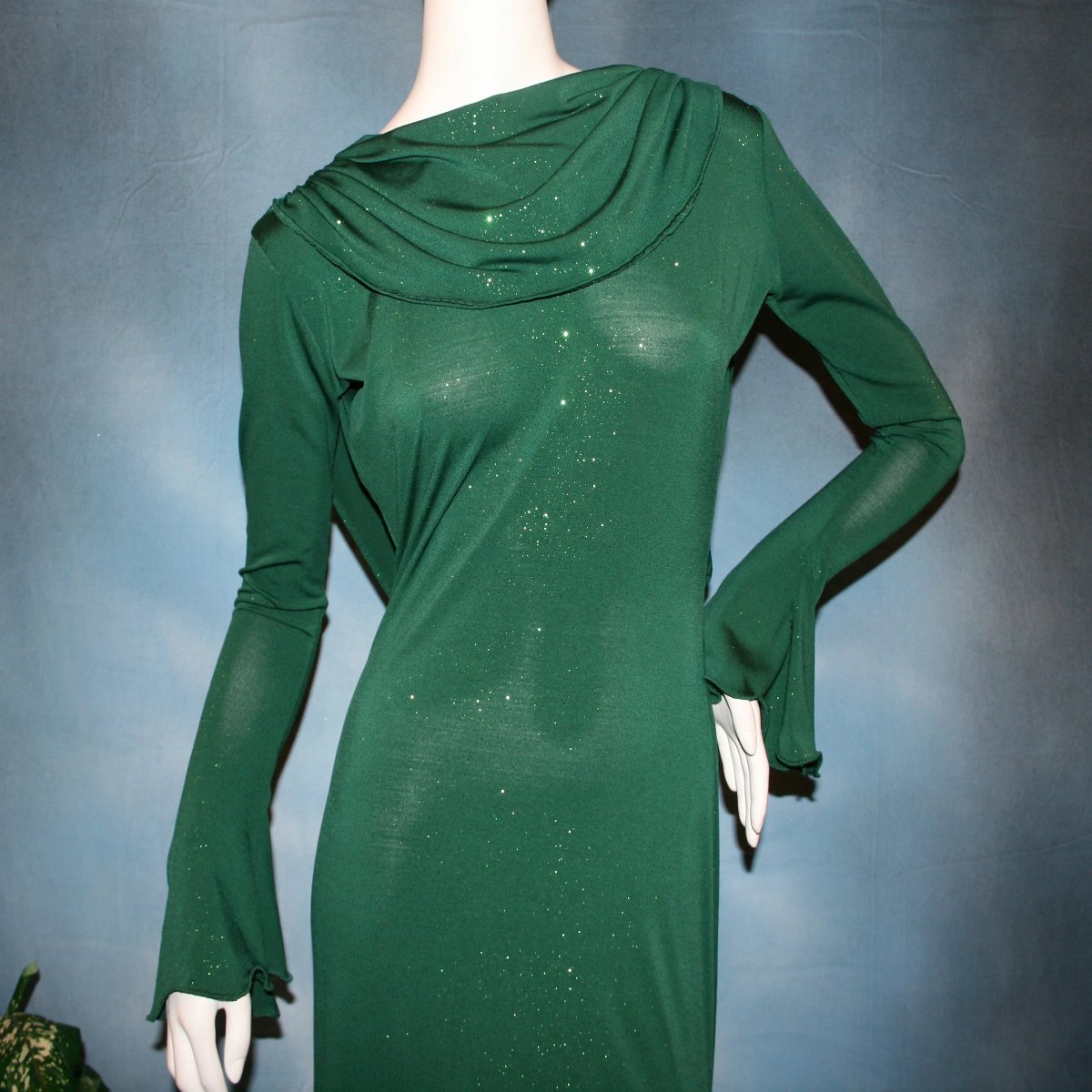 Crystal's Creations close up view of Green social ballroom dress was created in luxurious deep emerald glitter slinky, with full  & flaring skirt bottom, long flair sleeves & draping trailing down the back makes this gorgeous dress very elegant & classy!
