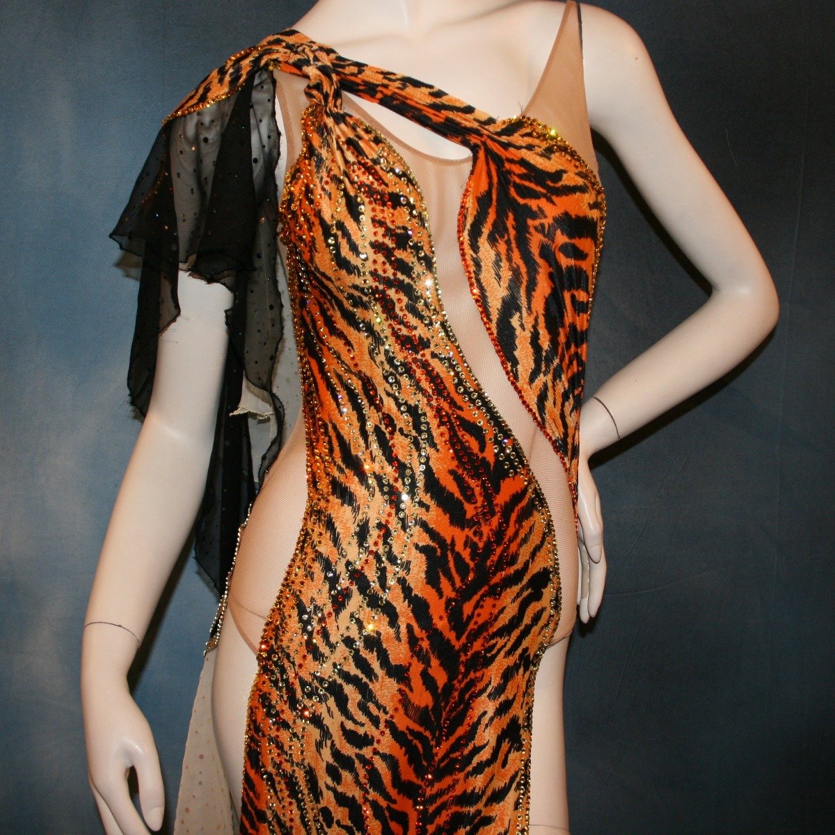 Crystal's Creations close up view of orange & black tiger print Latin/rhythm dress with pale yellow accents