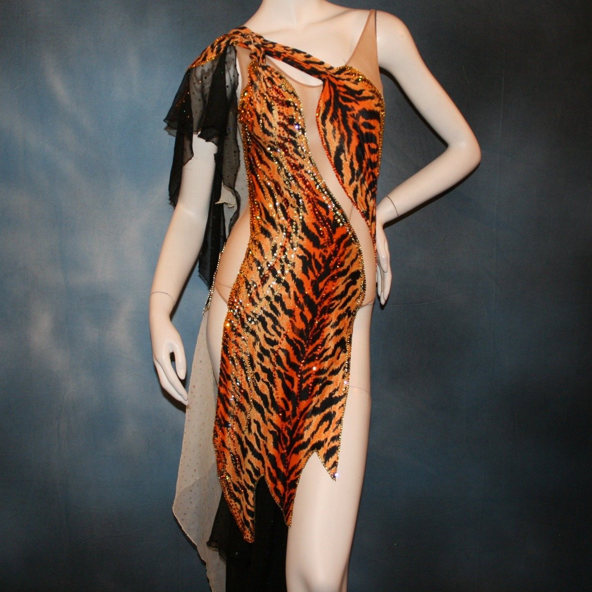 Crystal's Creations close up view of orange & black tiger print Latin/rhythm dress with pale yellow accents