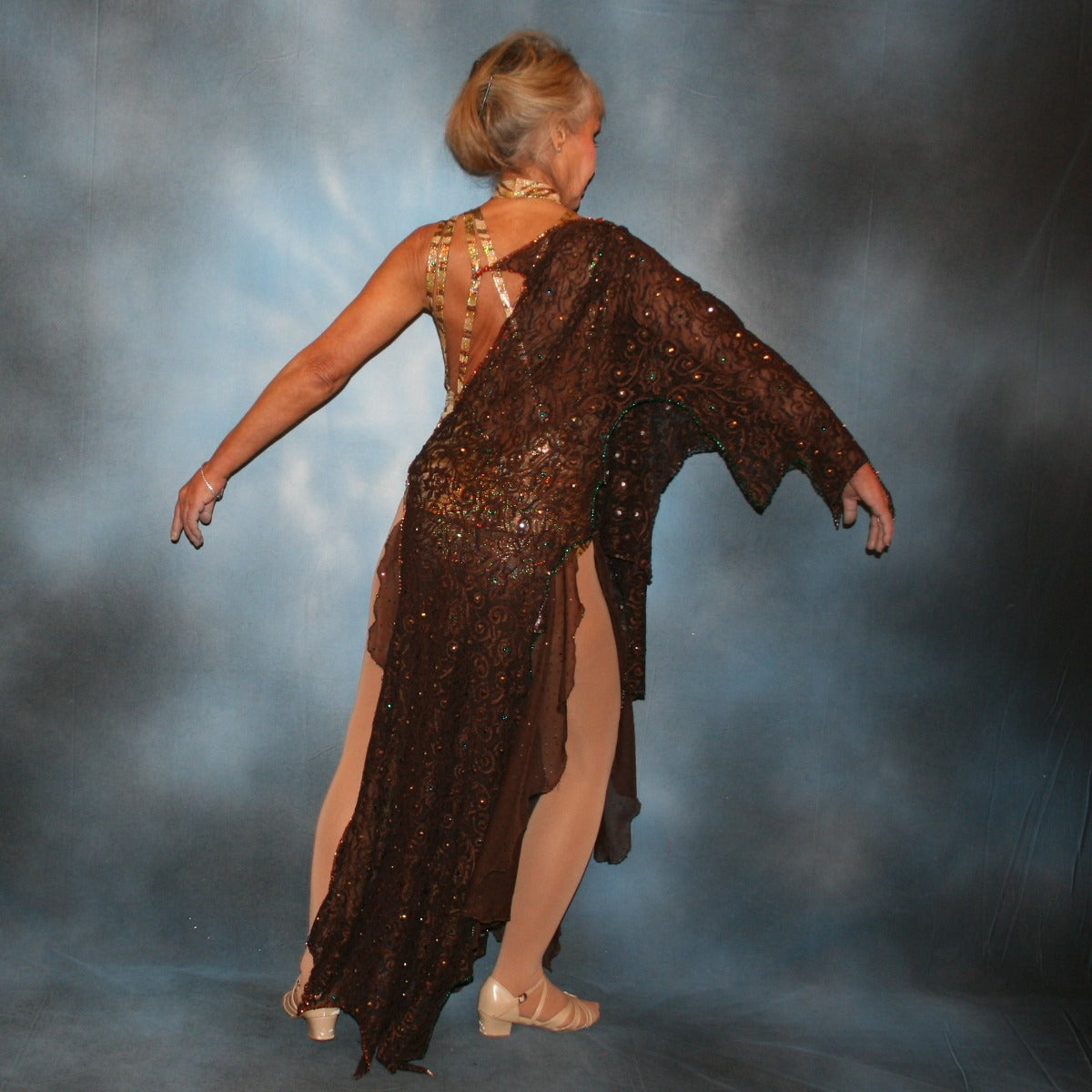 Crystal's Creations back view of Gold tango dress or Latin/rhythm dress created in chocolate brown stretch lace that is lavishly embellished with gold & a touch of emerald green Swarovski rhinestones overlayed & draped over a golden hologram tiger print bodysuit size 3/4-9/10