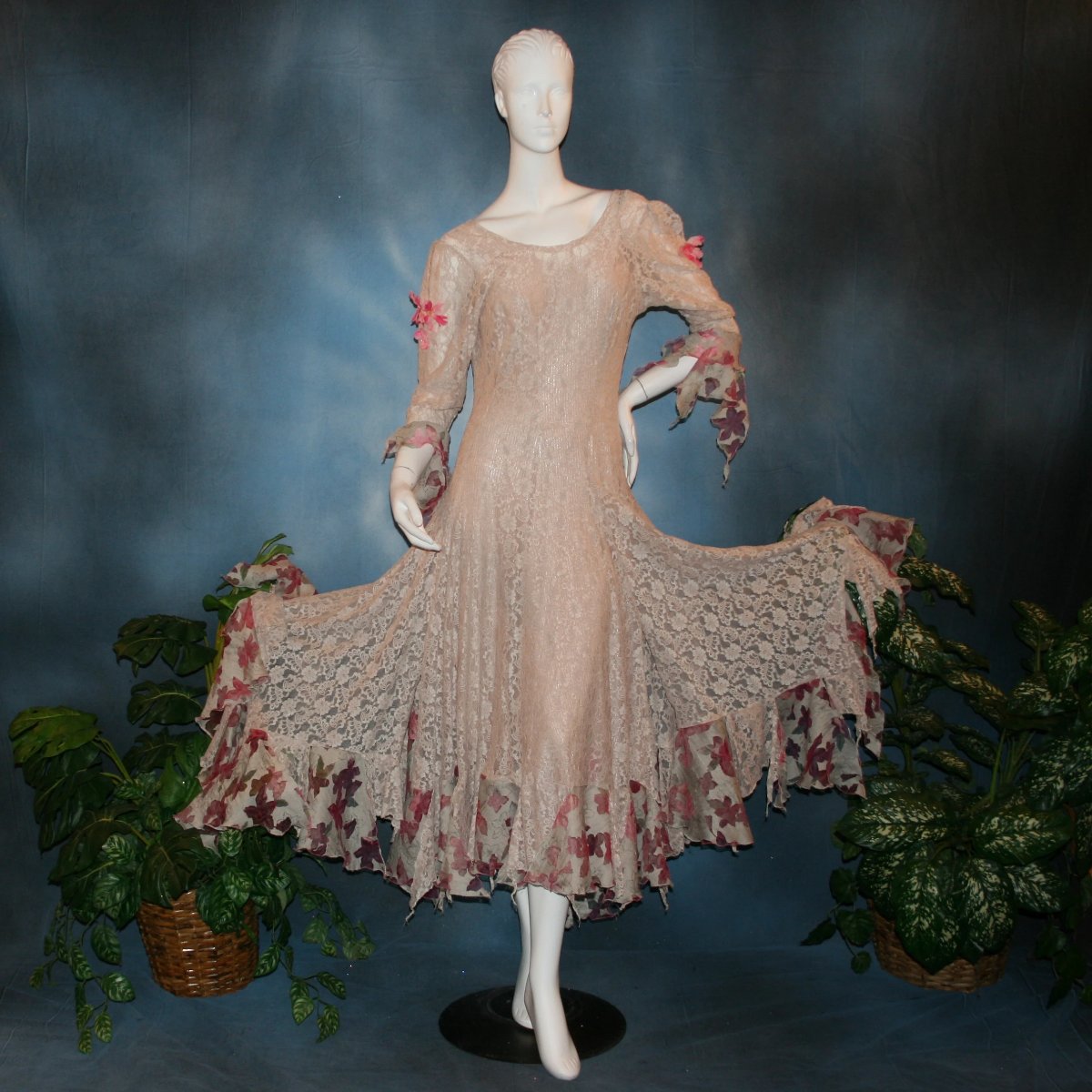 Soft beige social ballroom dress created of beige stretch lace with oodles of beige & pink flower print semi-sheer flounces, a touch of pink silk flowers with beading, & under slip dress. A great beginner ballroom dance show dress!
