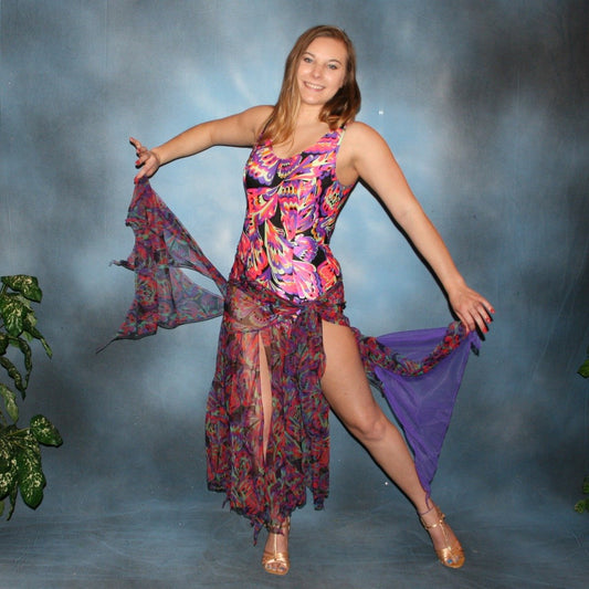 Crystal's Creations A very colorful theatrical ballroom dance dress has an Arabic look & is a low back, sleeveless bodysuit created in an abstract, exotic, & colorful lycra with a matching wrap style panel skirt of the same print in tricot chiffon, with a few solid purple accents embellished with Swarovski rhinestone work & large colorful teardrop shape lucite gems
