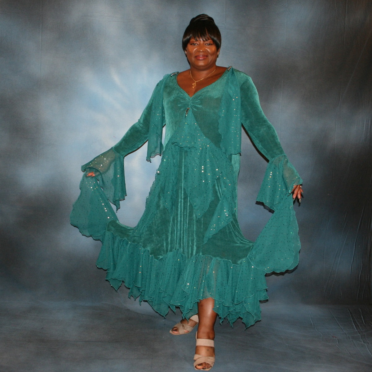 Teal plus size ballroom dance dress was created in luxurious teal solid slinky with oodles of champagne sequined chiffon flounces & floats, embellished with a lovely touch of Swarovski hand beading.