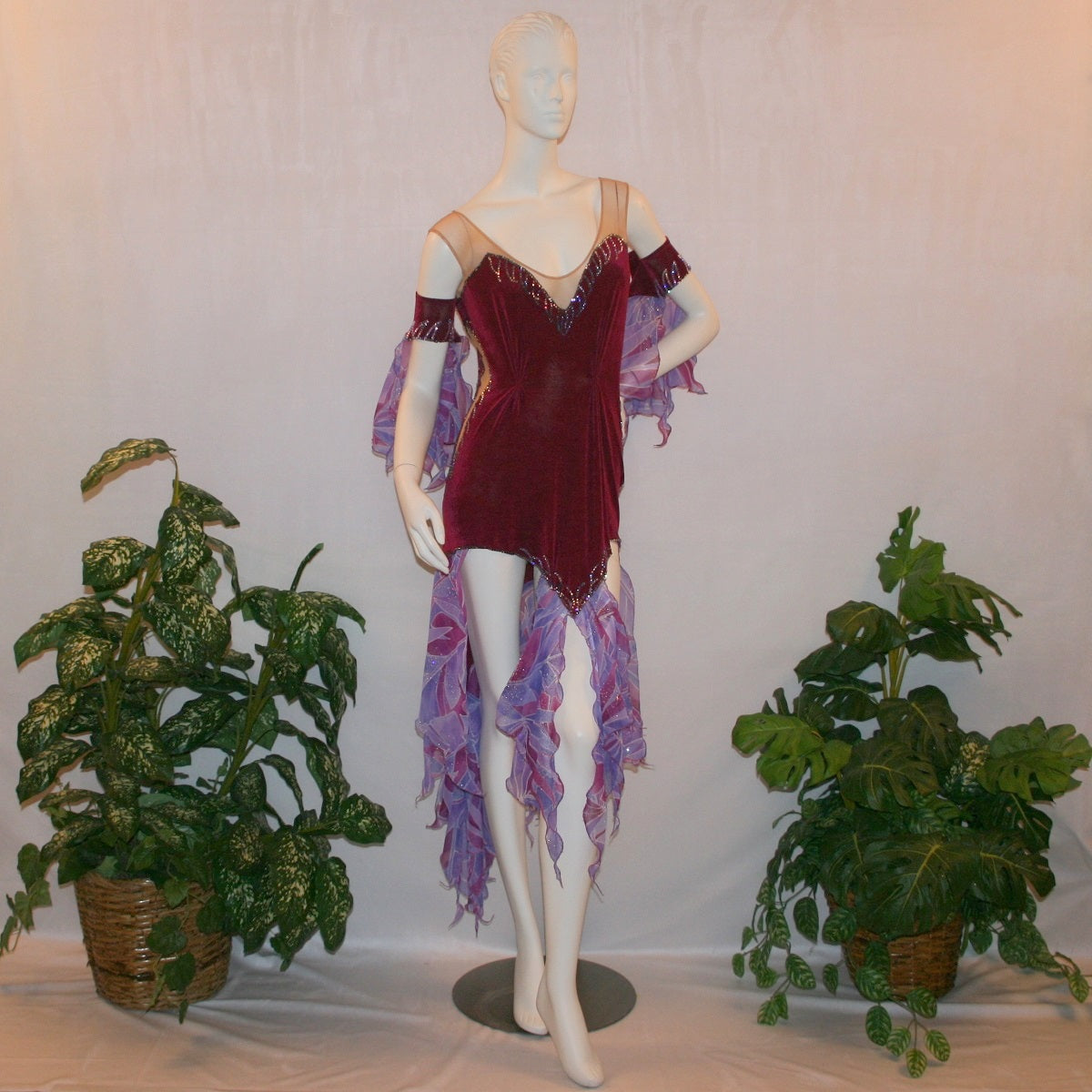 Crystal's Creations Latin-rhythm dress portion of Magenta converta ballroom dress created of magenta solid slinky on a nude illusion base with tropical chiffon print skirtings of magenta & orchids, is embellished with tanzanite & orchid rhinestone work.