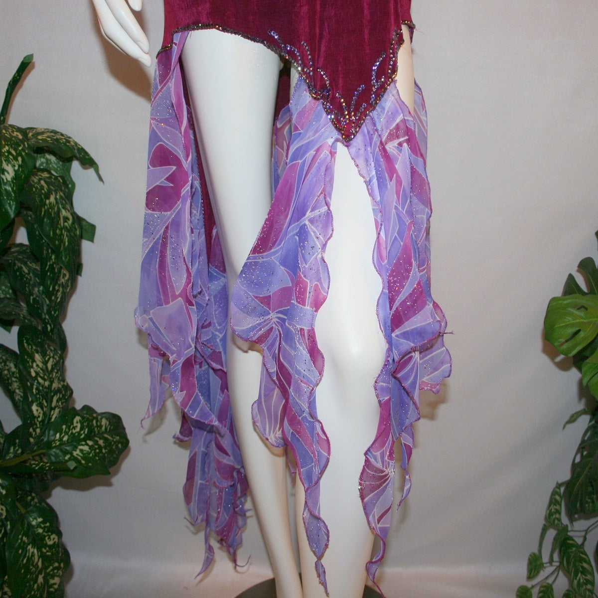 Crystal's Creations lower details of Magenta converta ballroom dress created of magenta solid slinky on a nude illusion base with tropical chiffon print skirtings of magenta & orchids, is embellished with tanzanite & orchid rhinestone work.