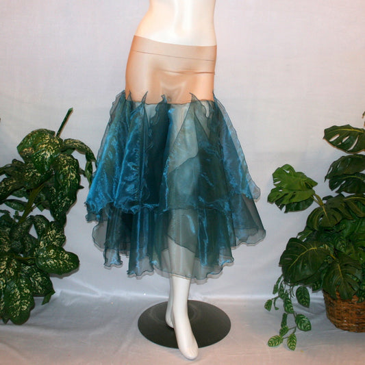 Blue ballroom skirt created with yards of a deep sea blue organza, layers of large petal shaped panels.