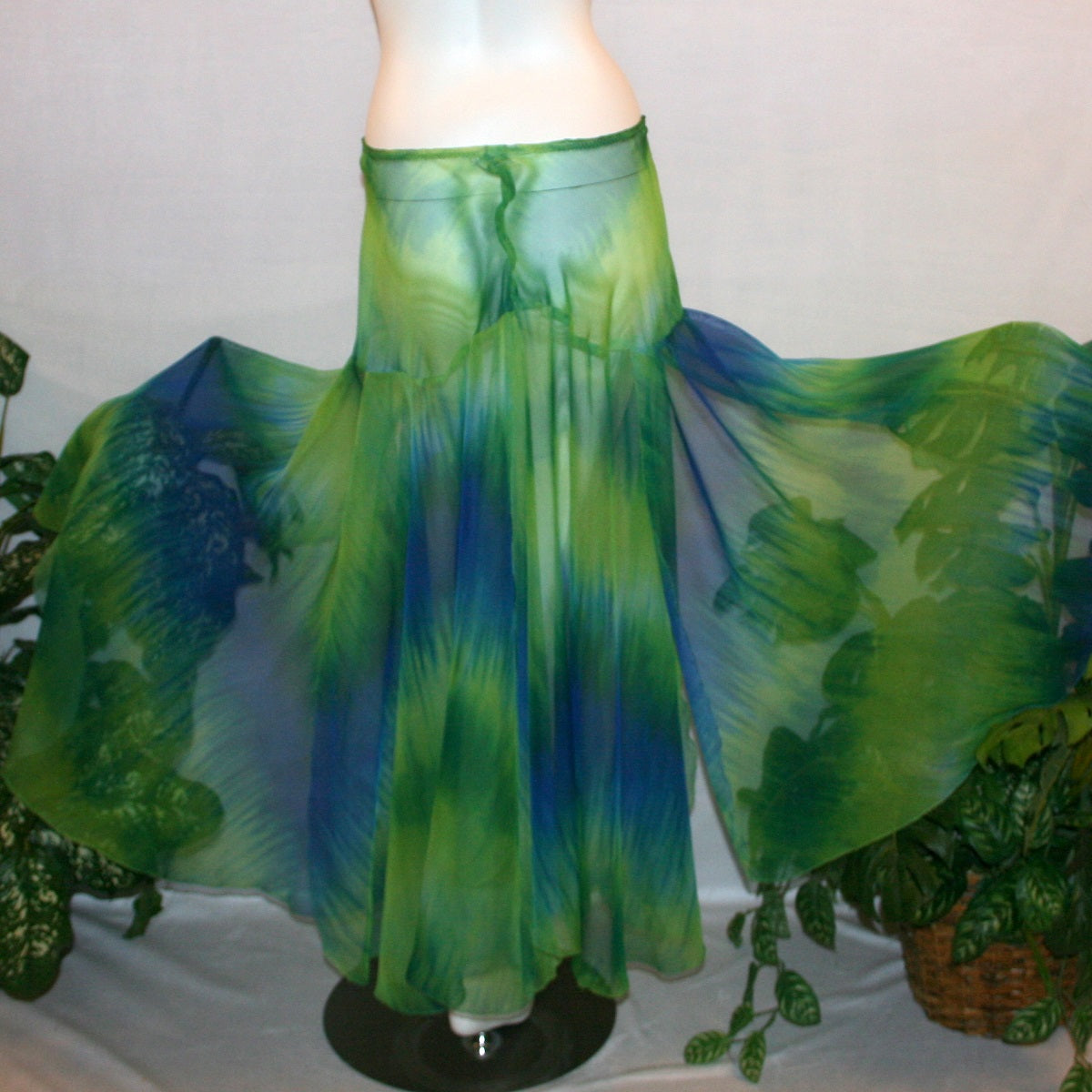 flaired back view of Blue & green ballroom skirt created in yards of a gorgeous blue & green variegated chiffon, flows beautifully for your waltzes & foxtrots.