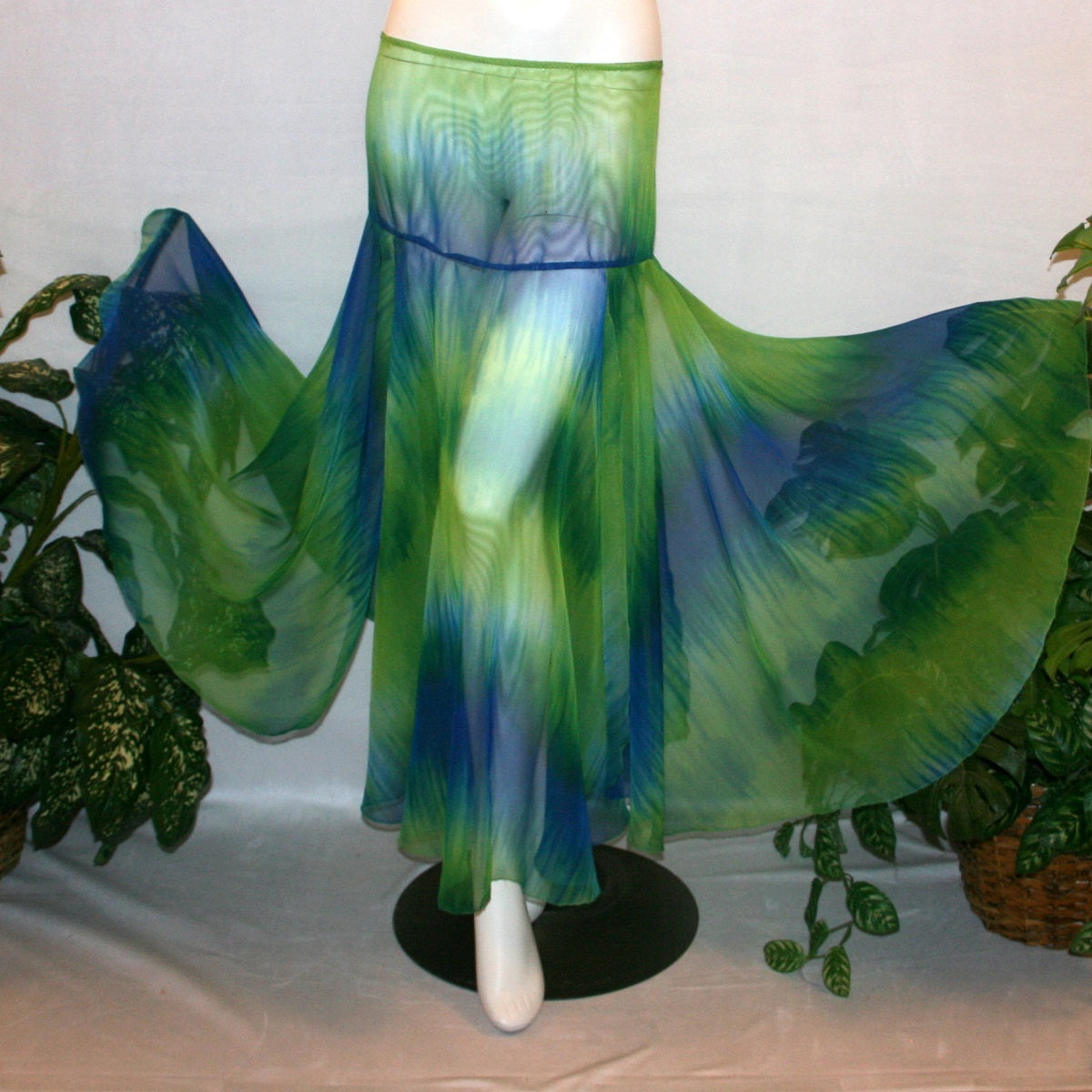 flaired view of Blue & green ballroom skirt created in yards of a gorgeous blue & green variegated chiffon, flows beautifully for your waltzes & foxtrots.