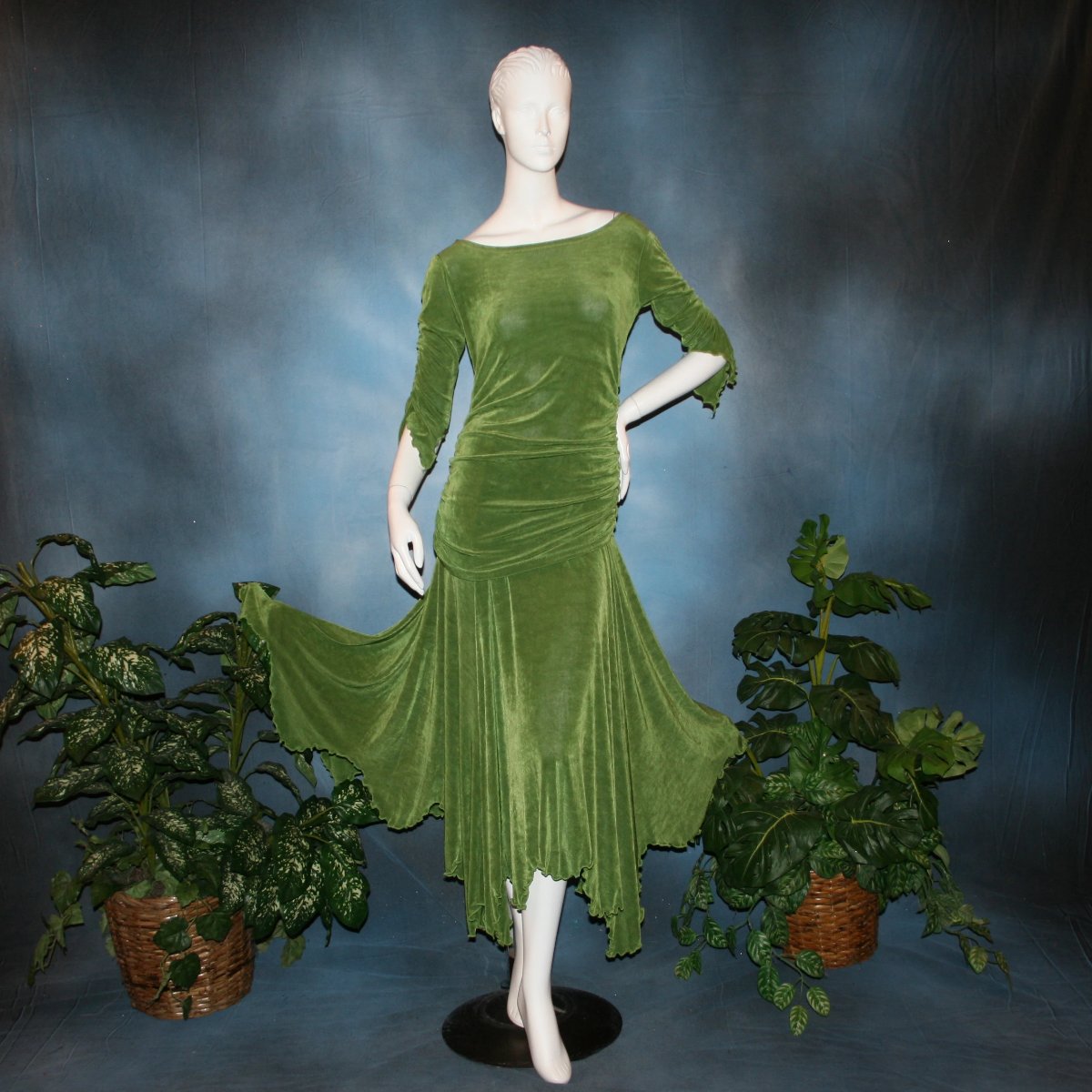 Ruched top with ruched 3/4 sleeves with a slight flaired detail includes trumpet flaired ballroom dance skirt with peaks created of luxurious olive green solid slinky fabric, & can be custom created in many colors.