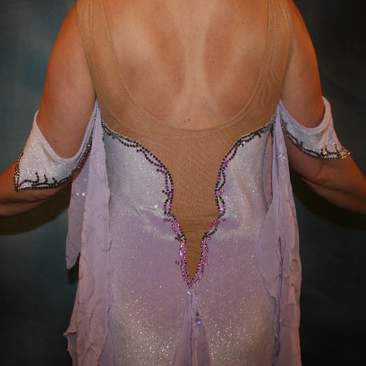 Crystal's Creations close up of back on Orchid ballroom dress created from luxurious glitter stretch velvet on nude illusion base with embroidered sequined chiffon insets & floats, embellished with crystal vitrail light Swarovski rhinestone work