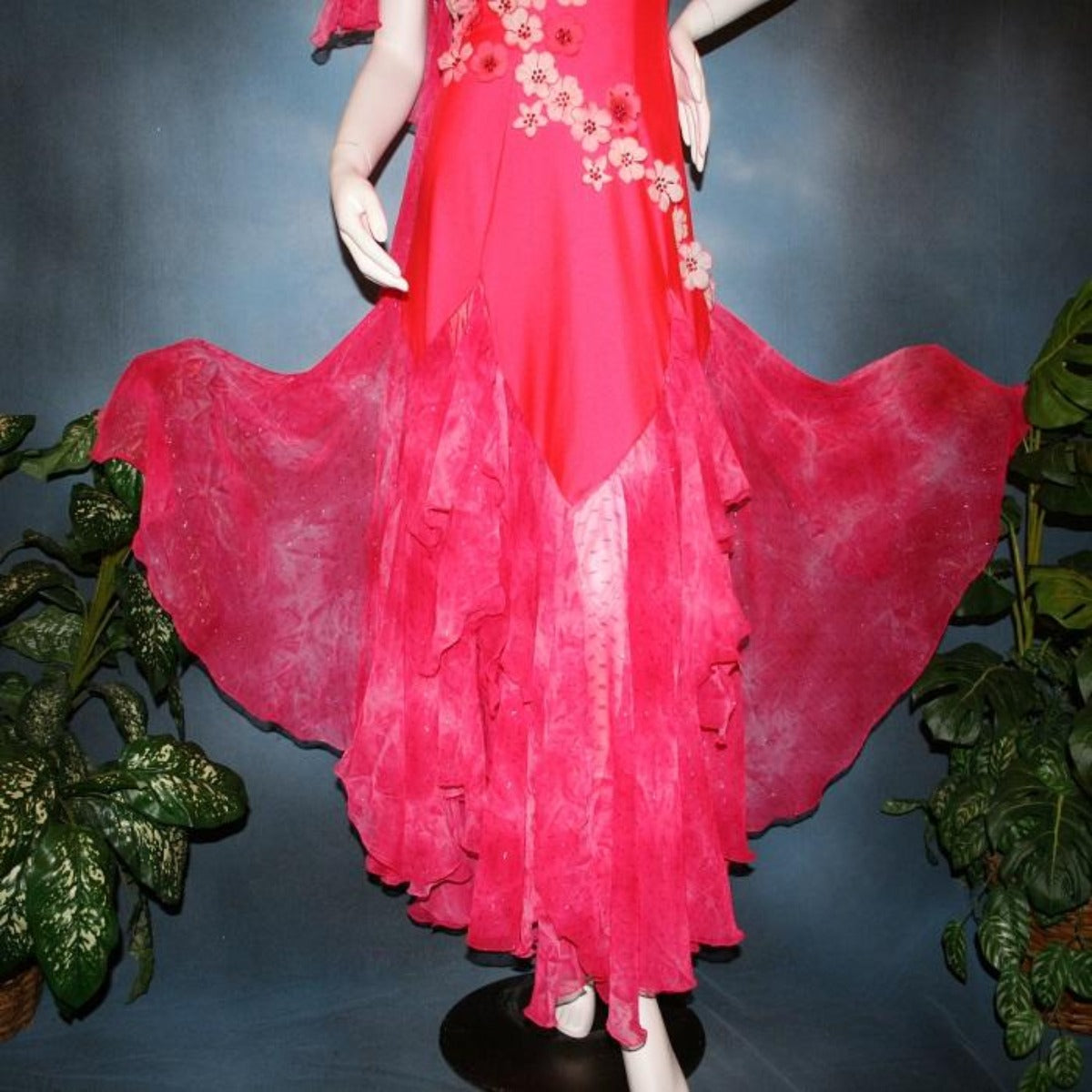 Crystal's Creations close bottom view of Deep pink ballroom dress created of Indian pink lycra base with yards & yards of Indian pink print chiffon large & flowing flounces, embellishing done with silk flowers, accented with Swarovski stonework in Indian pink 