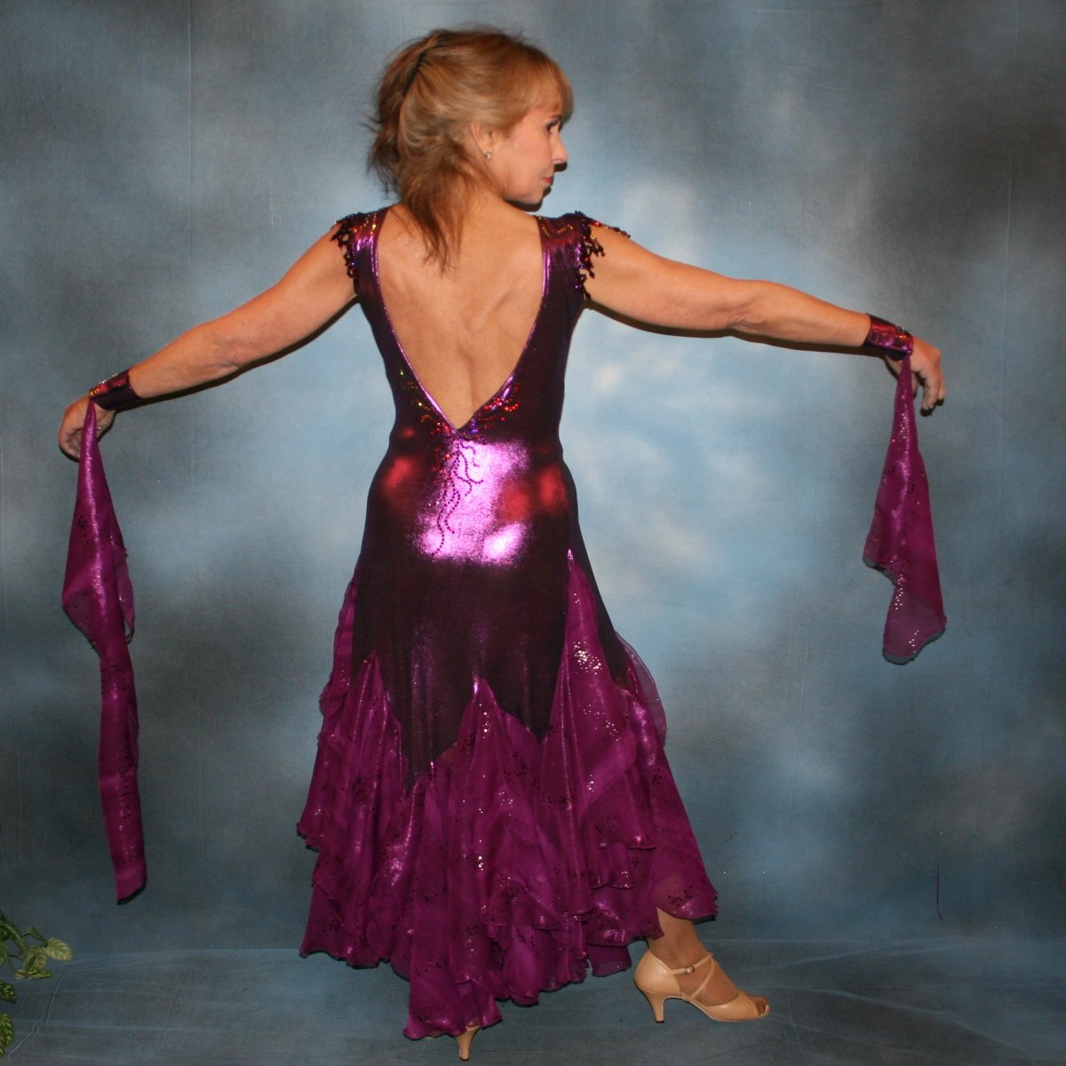 Crystal's Creations Purple ballroom dress was created in rich luxurious deep plum metallic slinky with yards & yards of champagne sequined, iridescent chiffon flounces & floats in shades of plum…dripping with crystal volcano Swarovski rhinestone work,