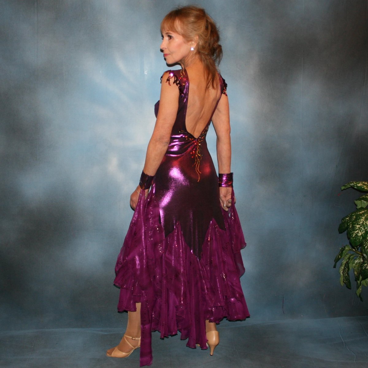 Crystal's Creations side view of Purple ballroom dress was created in rich luxurious deep plum metallic slinky with yards & yards of champagne sequined, iridescent chiffon flounces & floats in shades of plum…dripping with crystal volcano Swarovski rhinestone work,