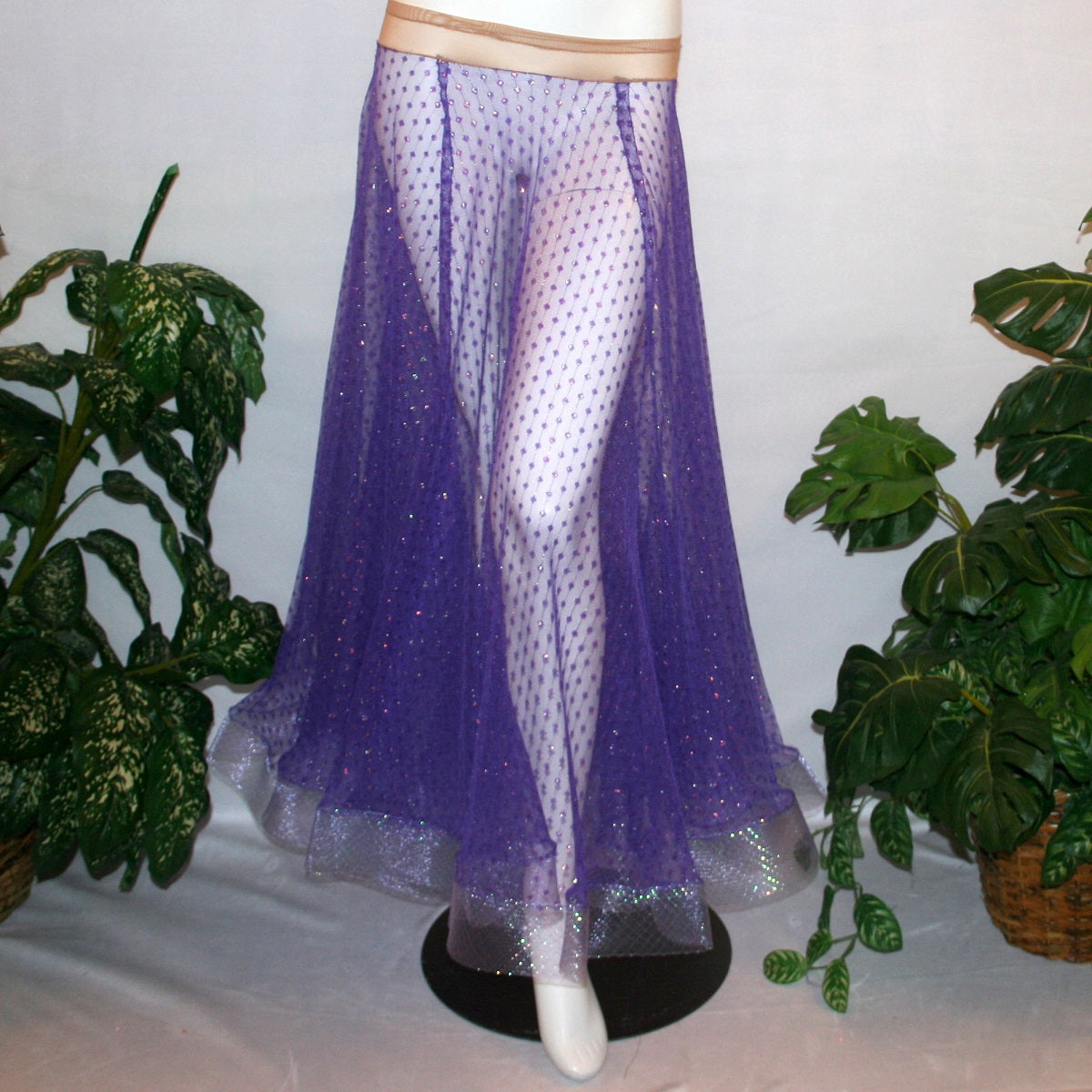 Purple ballroom skirt created of yards of textured purple iridescent glitter sheer fabric with 4" iridescent horsehair hem. 