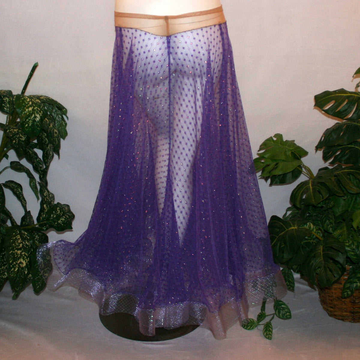 back view of Purple ballroom skirt created of yards of textured purple iridescent glitter sheer fabric with 4" iridescent horsehair hem. 