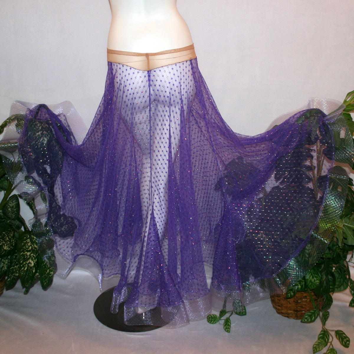flaired back view of Purple ballroom skirt created of yards of textured purple iridescent glitter sheer fabric with 4" iridescent horsehair hem. 