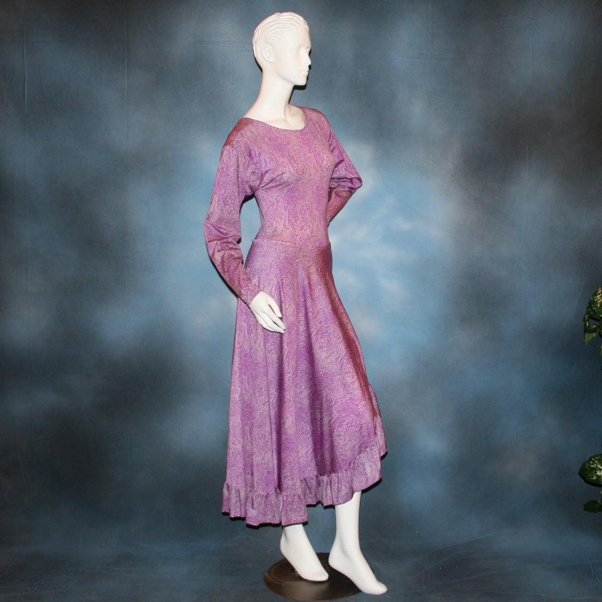 right side view of Purple bodysuit with ruffled Latin/rhythm skirt of reptilia purple print lycra, with a slight iridescent sheen, great for any ballroom dance, ballroom teachers or practice.