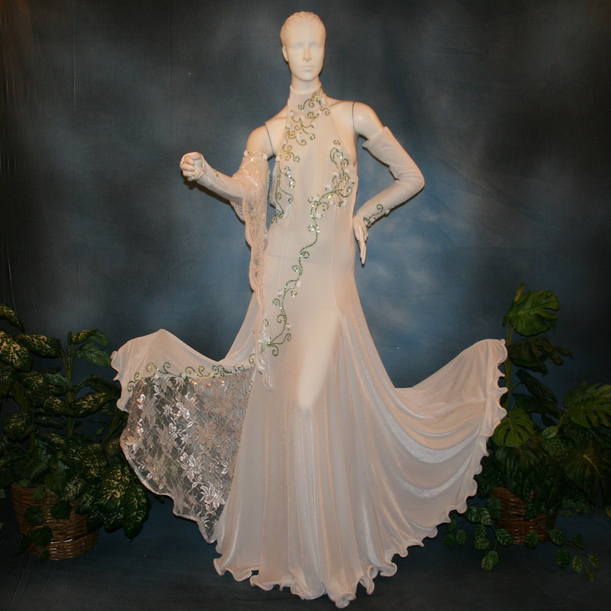 Crystal's Creations White ballroom dance dress was created in luxurious white stretch velvet with sequined lace insets & arm float, embellished with green peridot Swarovski detailed rhinestone work & miniature silk roses, and recently added more detail work