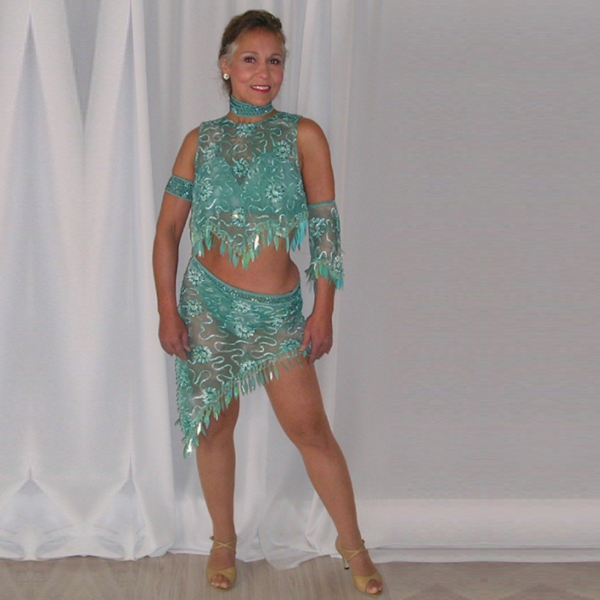 Crystal's Creations Gorgeous aqua Latin/rhythm two piece dance dress created of gorgeous aqua soutache lace fabric, embellished with about 10 gross of Aqua AB Swarovski stones with lots of hand beading & paillettes.